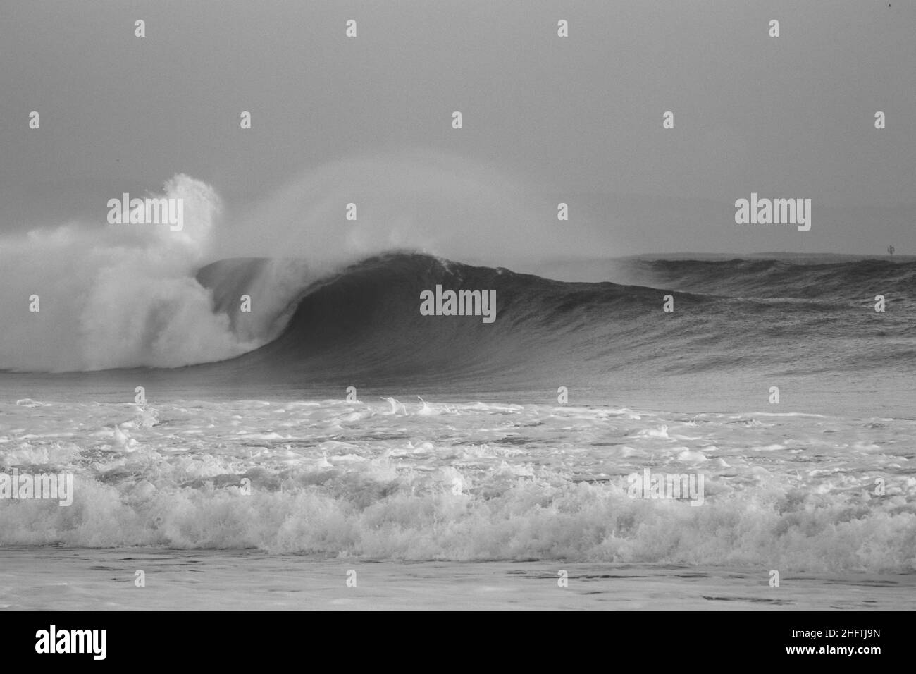 Perfect wave breaking in a beach. Perfect barrel in a surf spot Stock Photo