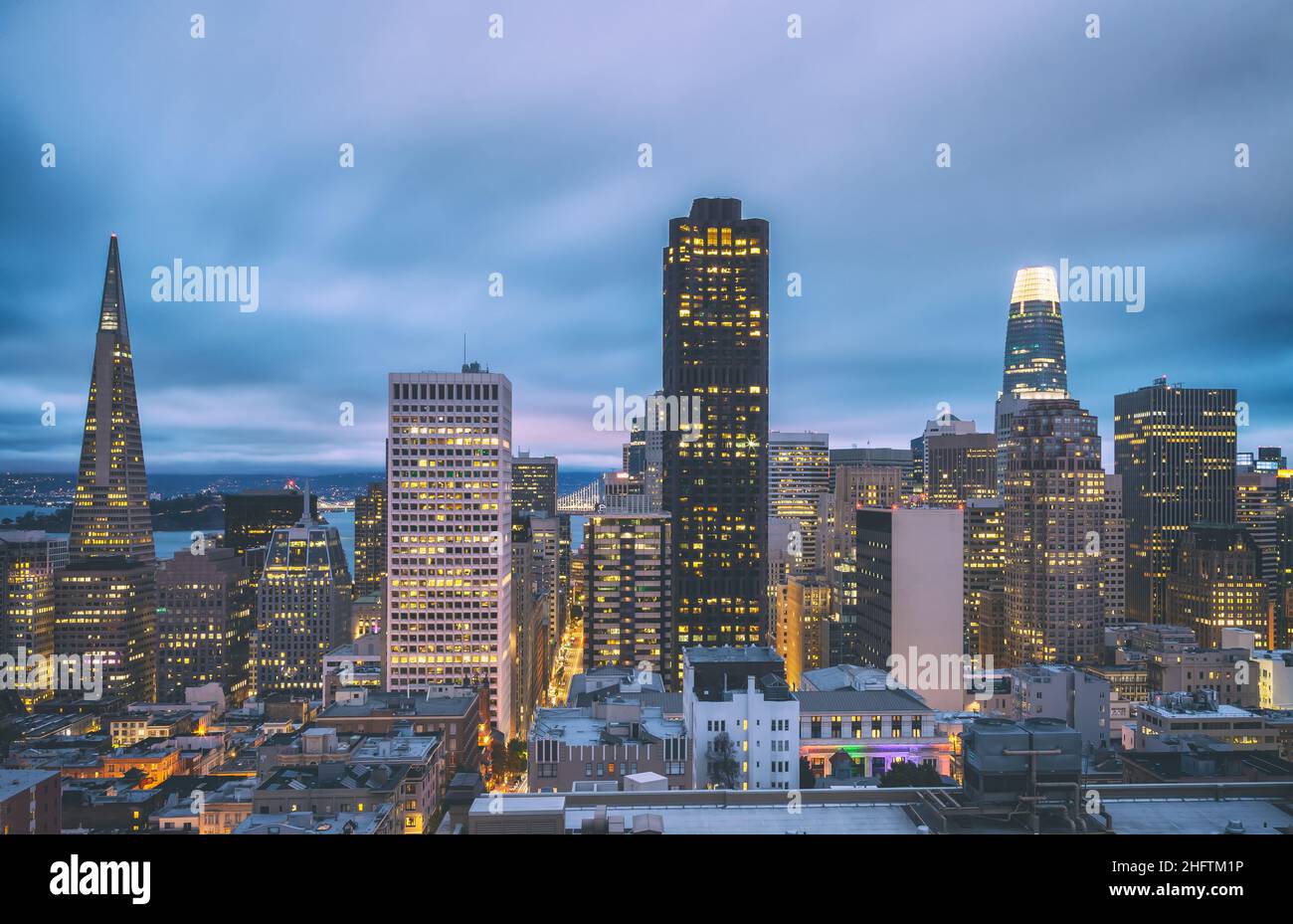 View of the San Francisco Downtown, with the view of the San Francisco Bay, at nightfall, California, United States. Stock Photo