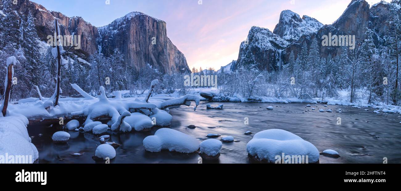 Panorama of the iconic view of Yosemite Valley by the Merced River in winter, Yosemite National Park, California, USA, at early dawn. Stock Photo