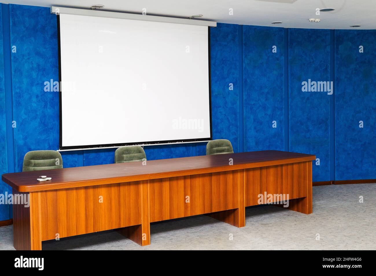 Empty, clean the screen to show the images in a small, cozy meeting room, as background for design Stock Photo