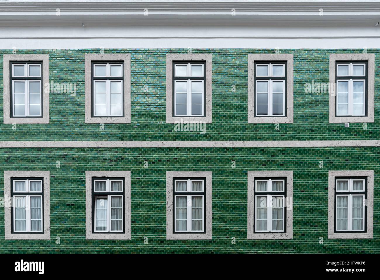 Architectural detail close-up of traditional green tile wall facade of apartment building in Lisbon Portugal Stock Photo