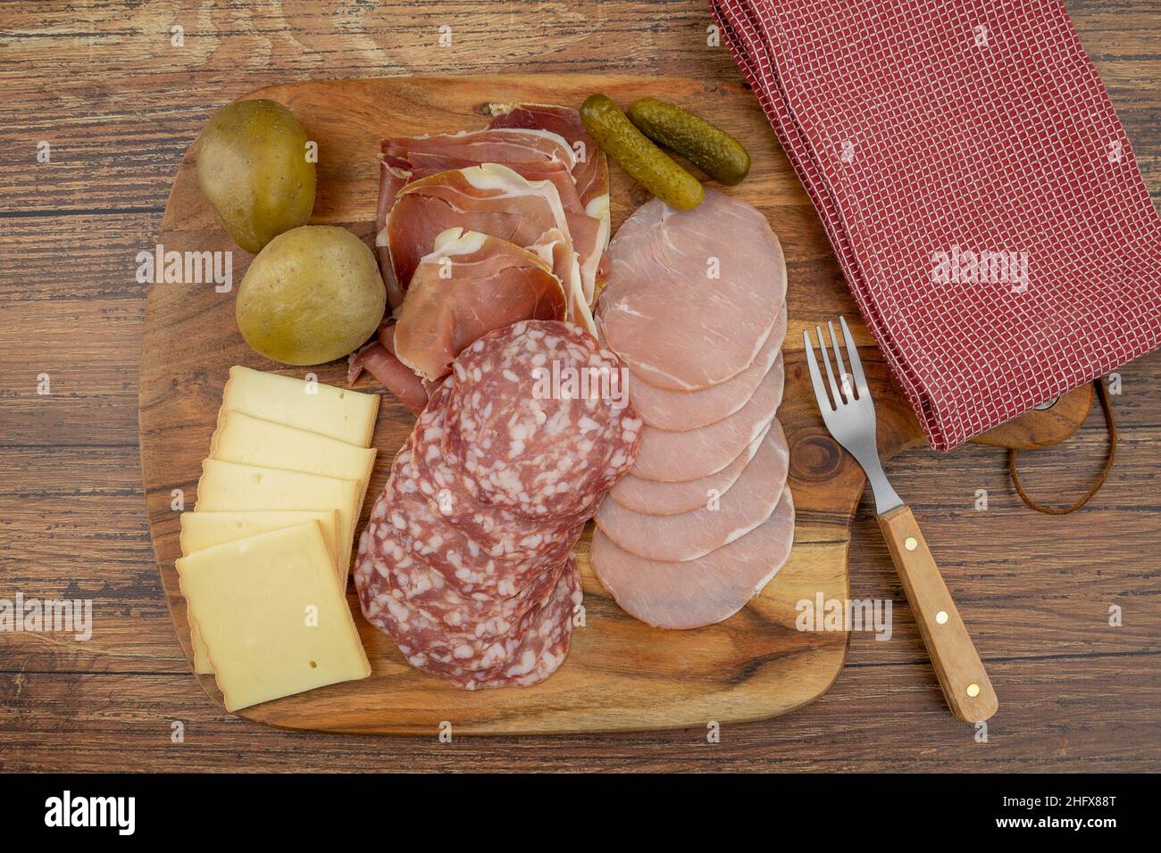 charcuterie and cheese board for a raclette Stock Photo Alamy