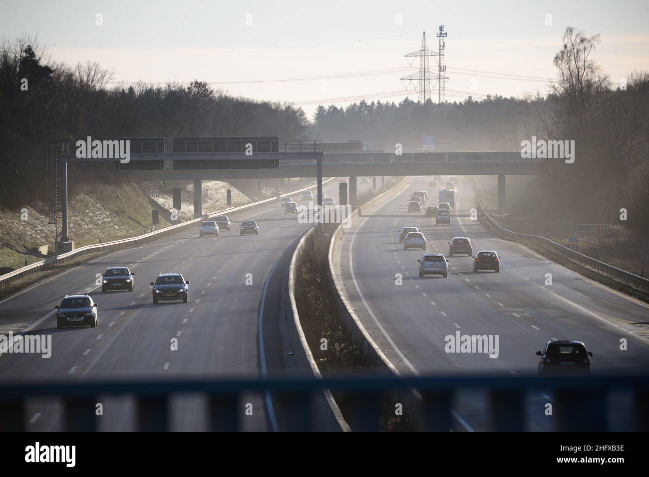 Quickborn, Germany. 26th Dec, 2021. Cars drive in the afternoon in the ...