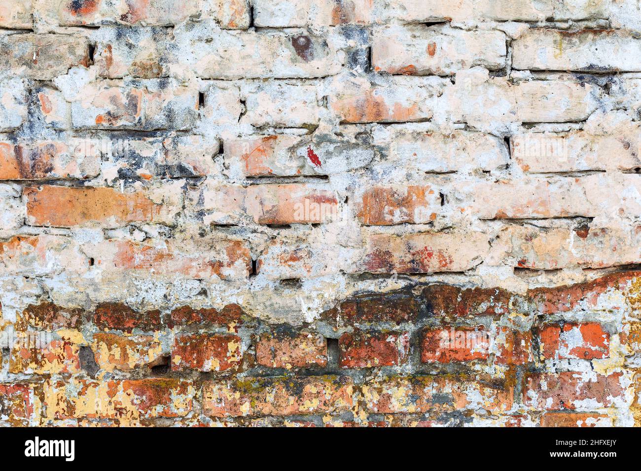 Abstract background old white brick wall with cracks and scratches ...