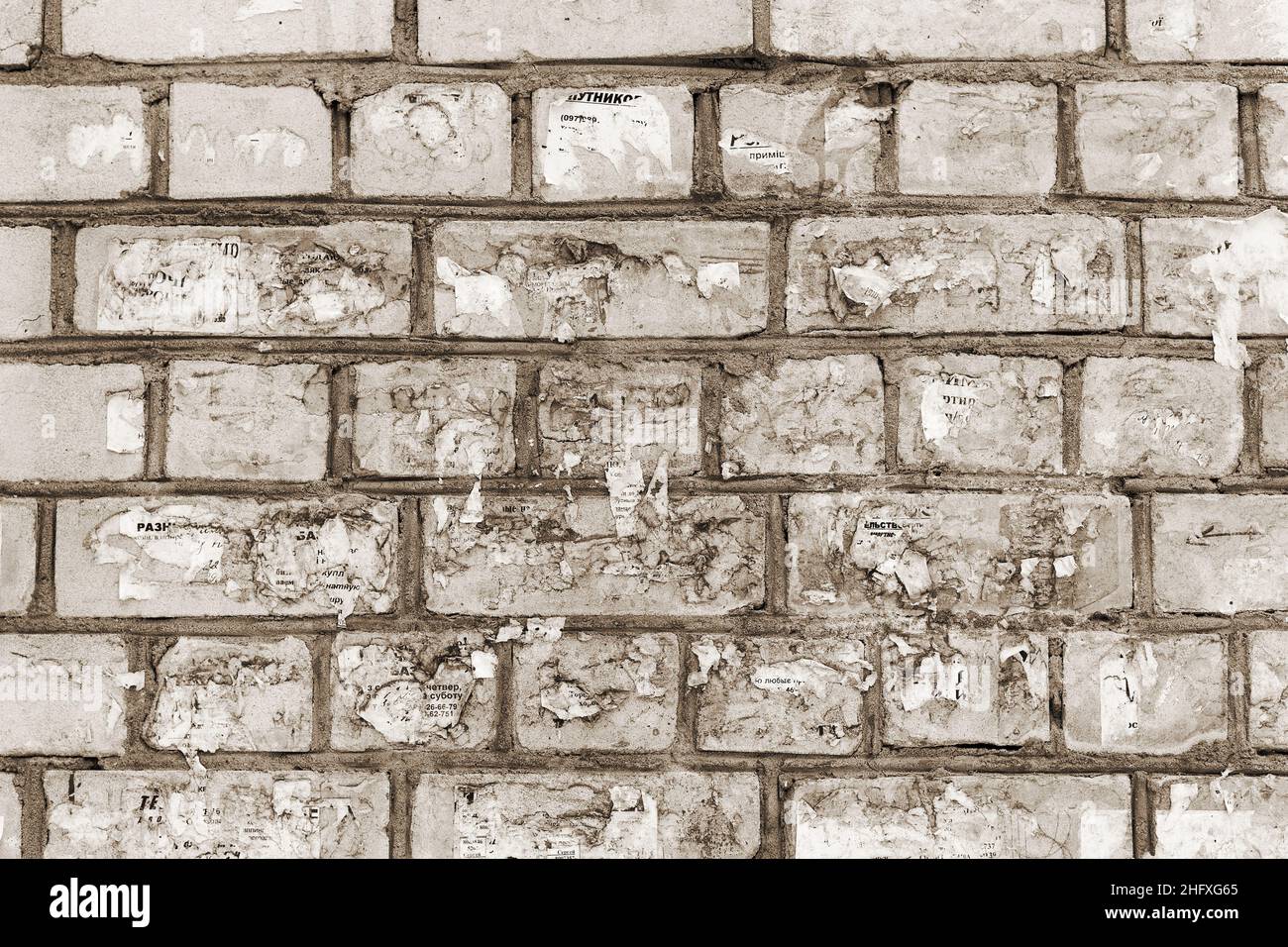 Abstract background old white brick wall with cracks and scratches ...