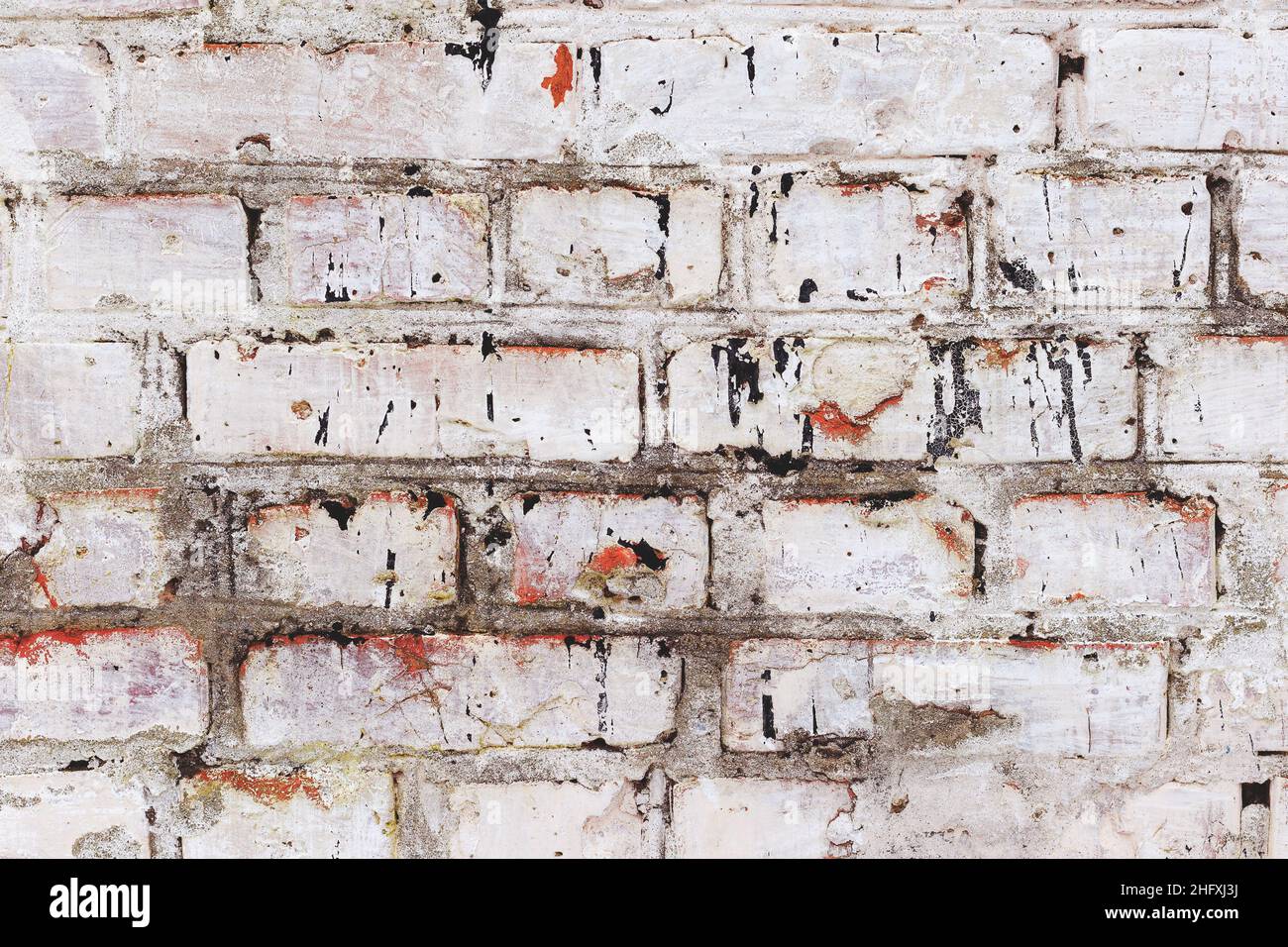 Abstract background old white brick wall with cracks and scratches ...