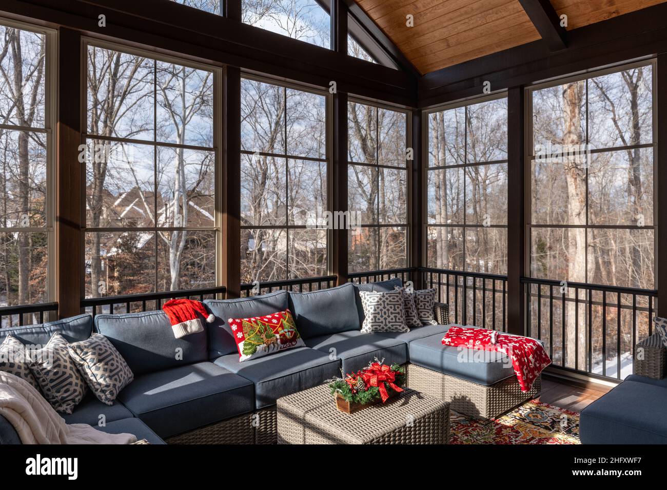 Cozy screened porch winter during Holidays season, snowy roofs and ...