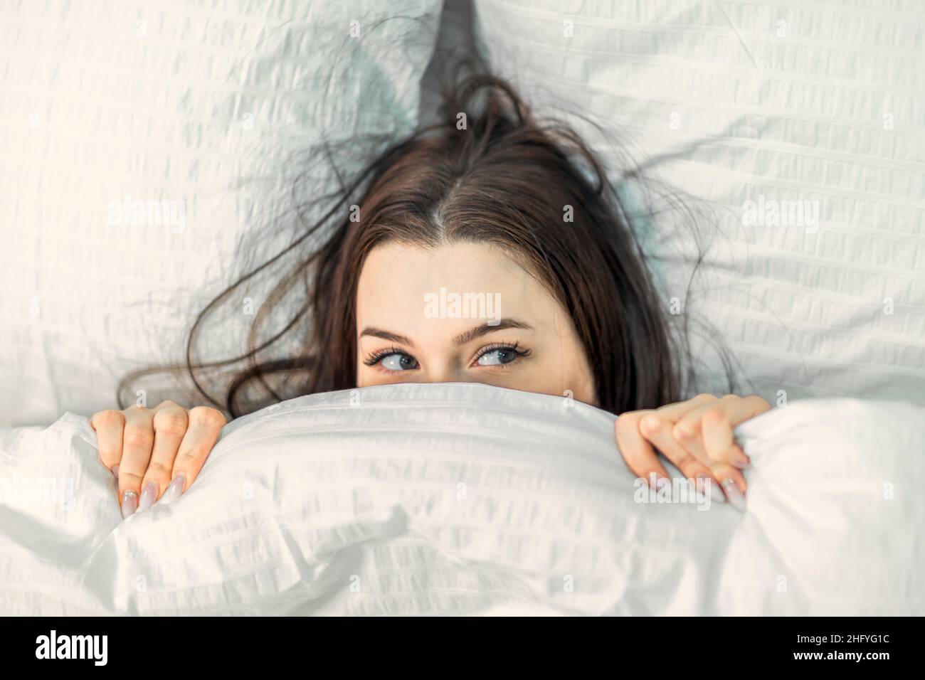 Head under bed cover adult hi res stock photography and images Alamy