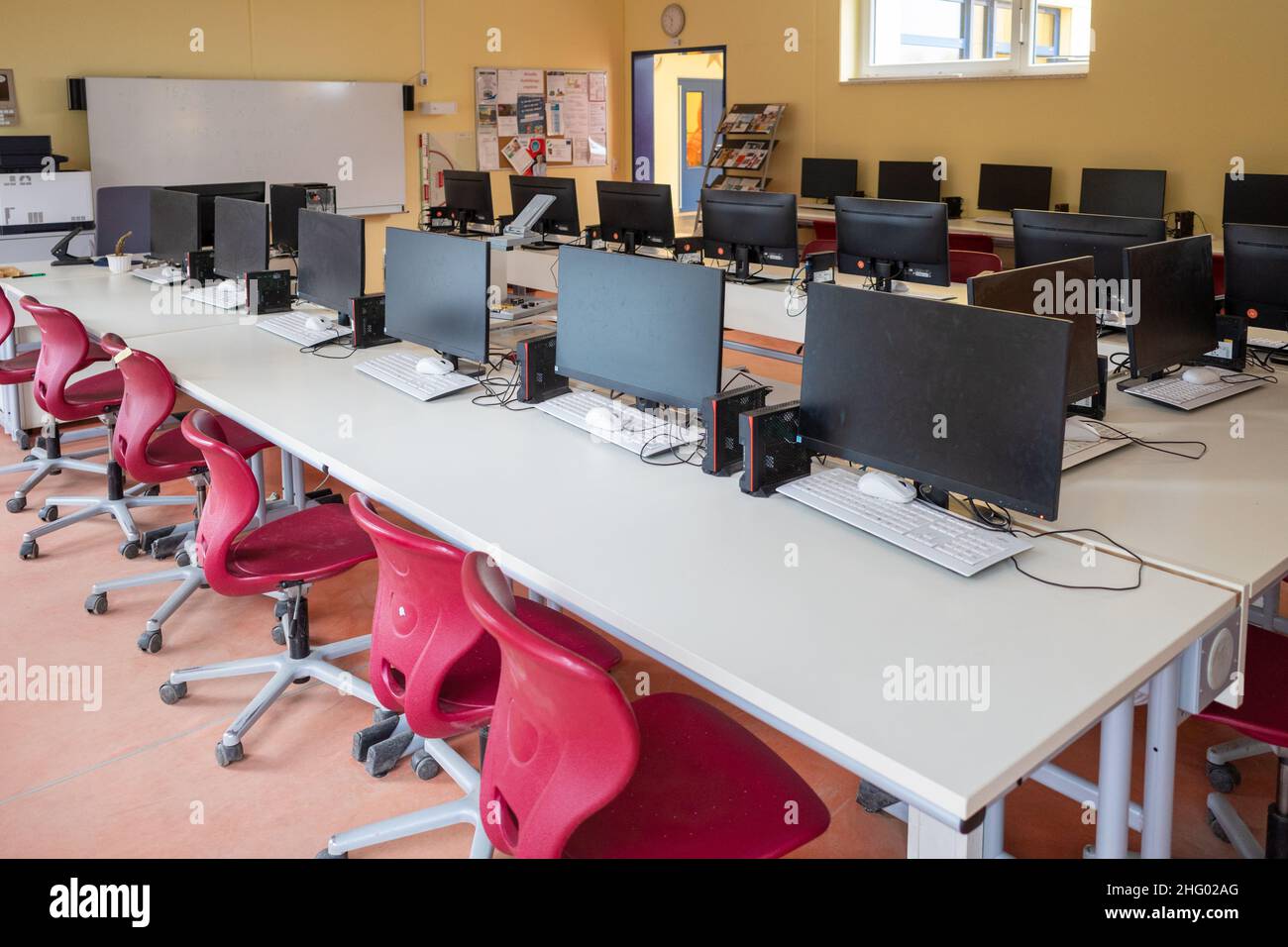many computers are in the computer cabinet in a school Stock Photo