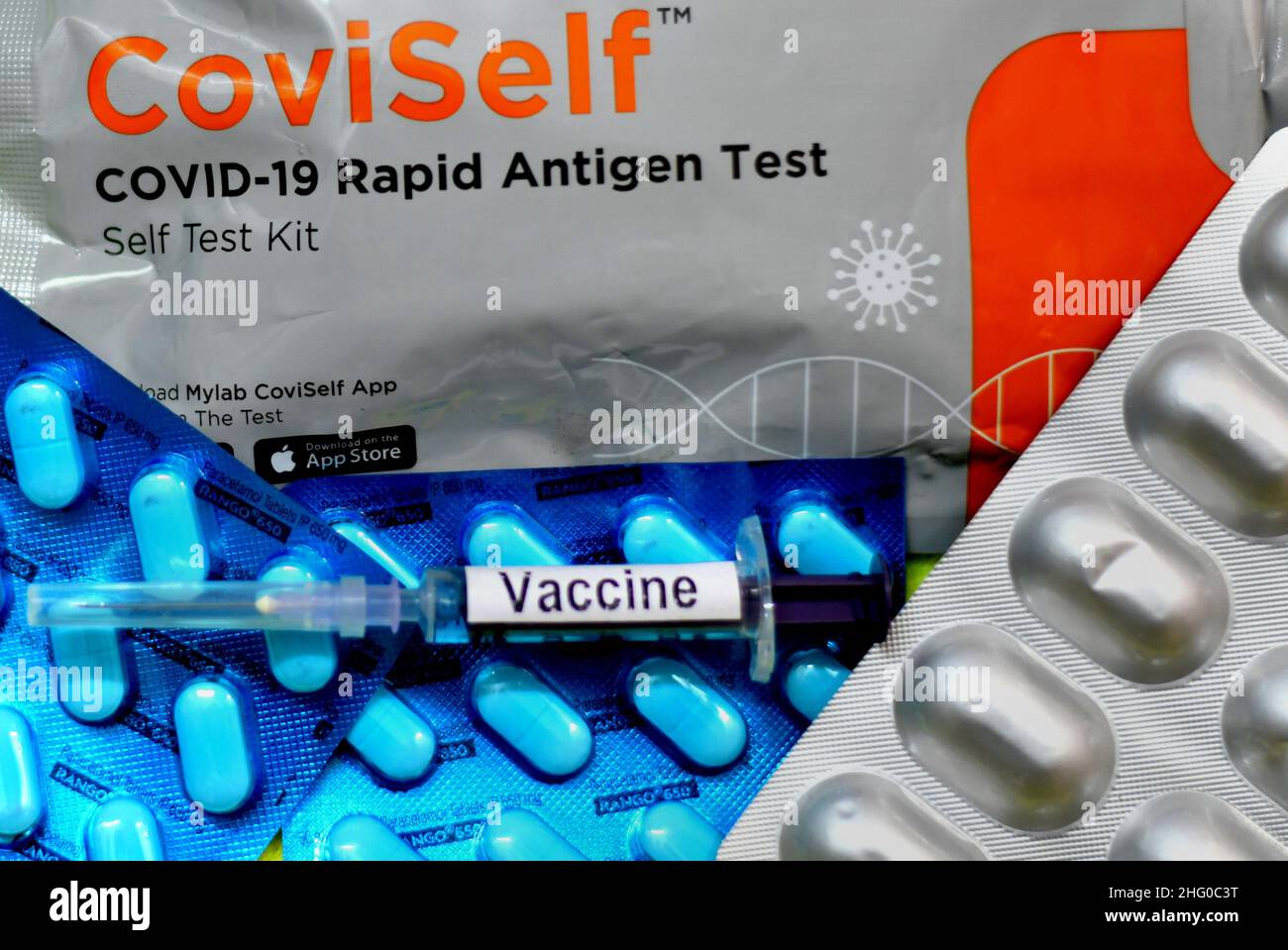 A Coviself Test kit is seen displayed along with a Vaccine injection