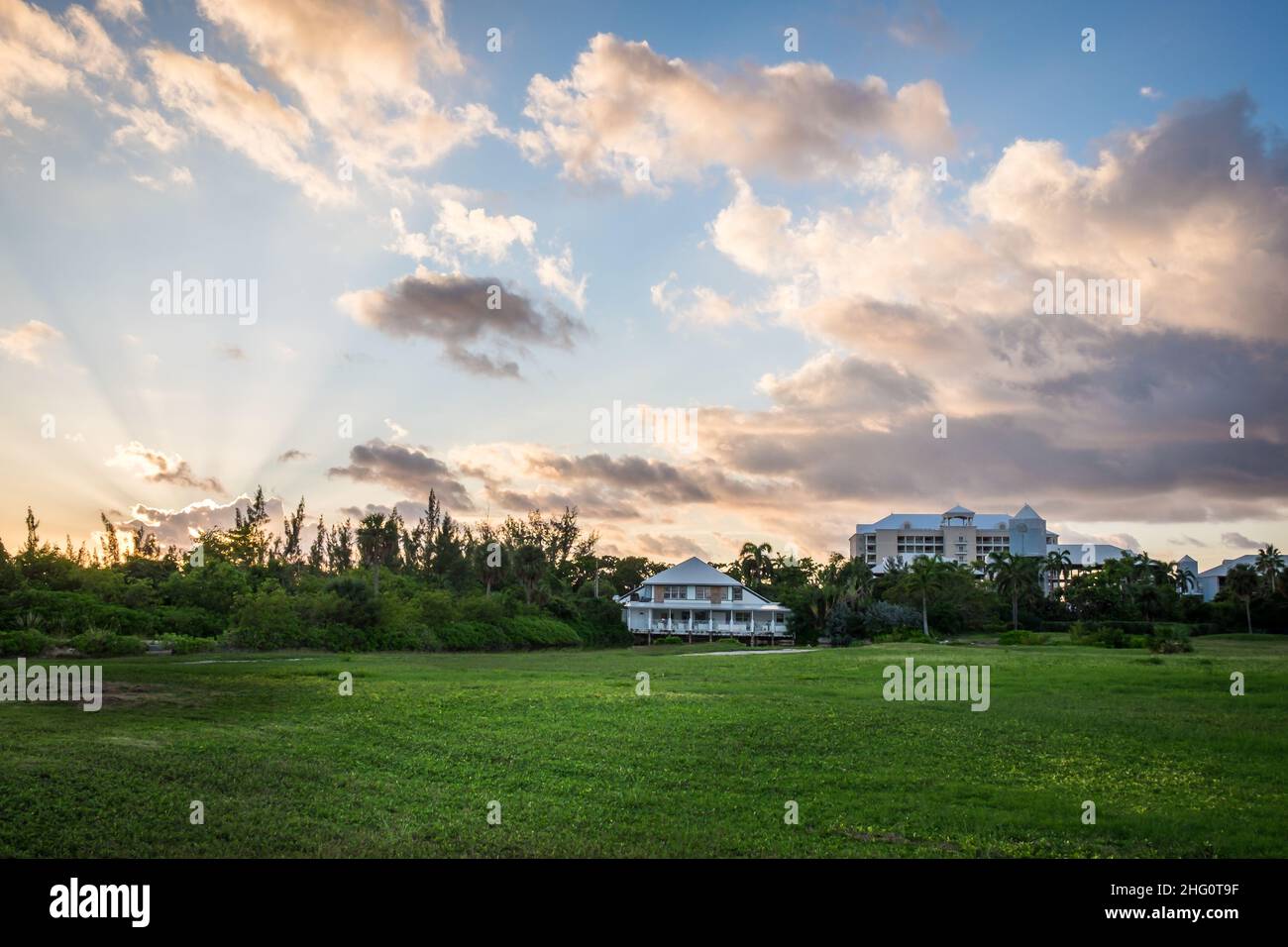 Grand Cayman, Cayman Islands, Nov 2021, buildings by a redundant golf course at sunset Stock Photo