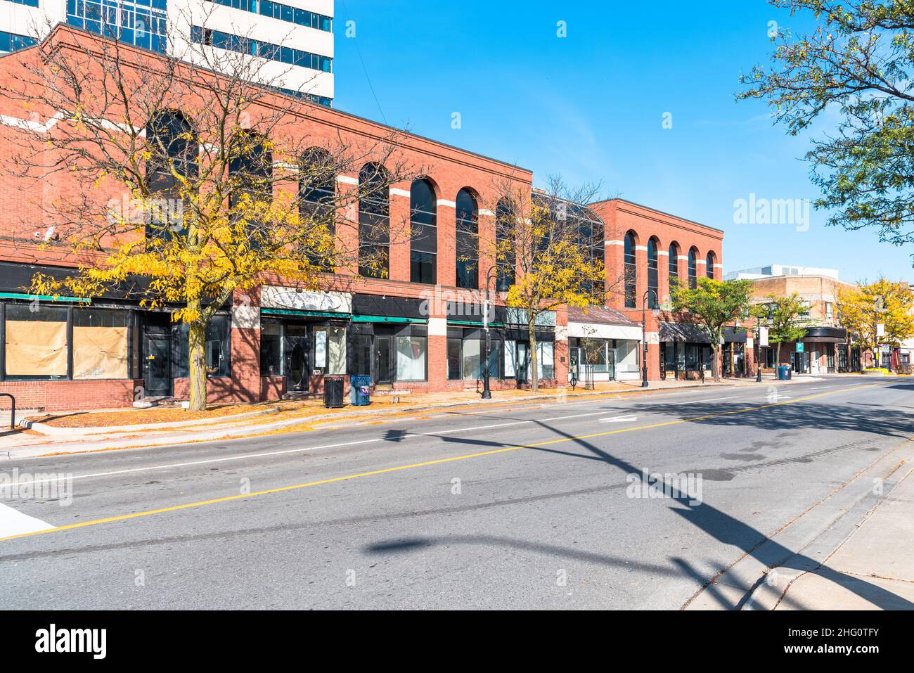 Closed business due to economic downturn along a street on a sunny autumn day Stock Photo