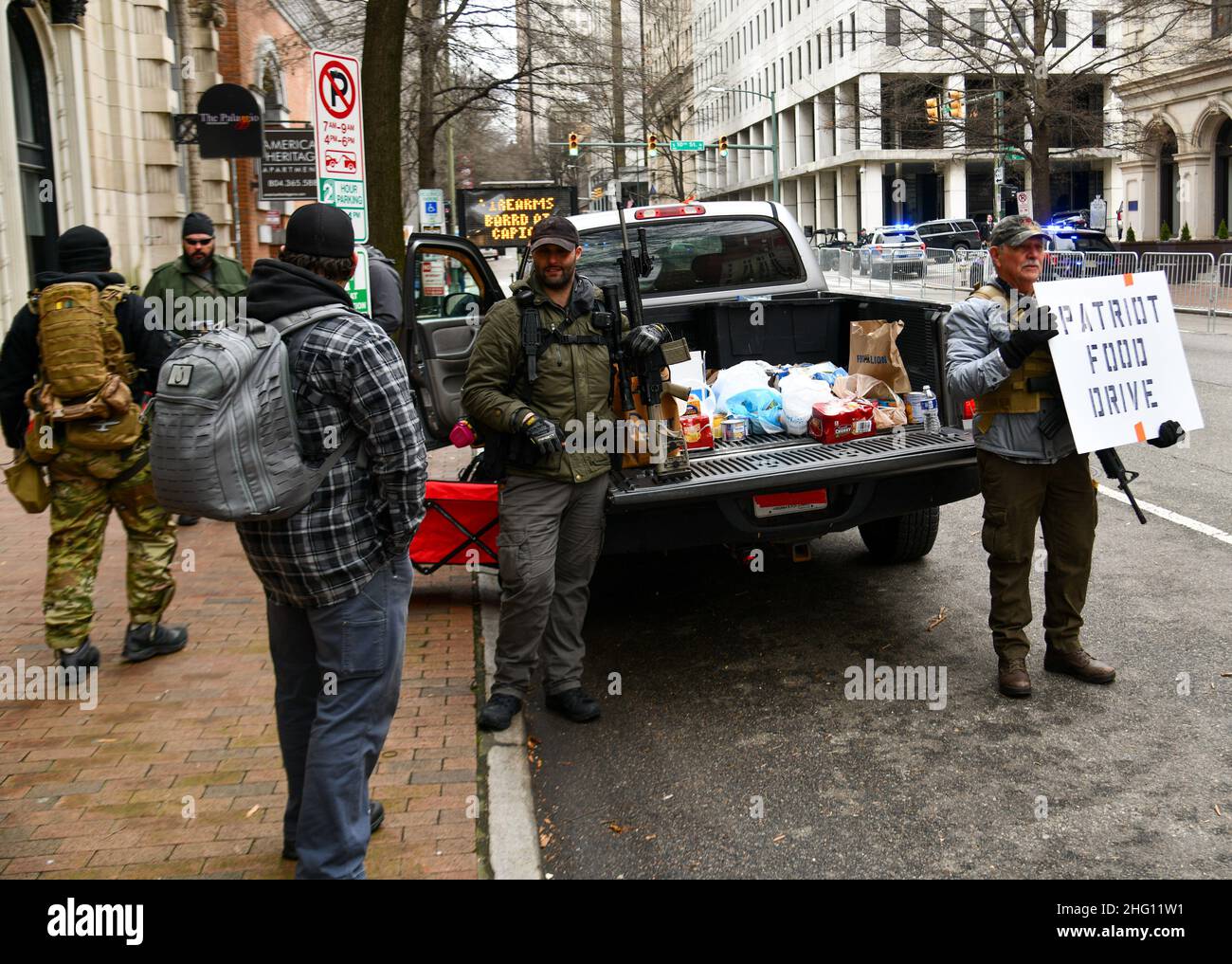 Richmond, USA. 17th Jan, 2022. Armed protesters from multiple groups advocating for gun rights demonstrate in the streets surrounding the Virginia State Capitol and hold a food drive on Martin Luther King Jr. Day, January 17, 2022 in Richmond, Virginia. Police forced participants to leave restricted areas bordering government land but no arrests were made. (Photo by Matthew Rodier/Sipa USA) Credit: Sipa USA/Alamy Live News Stock Photo
