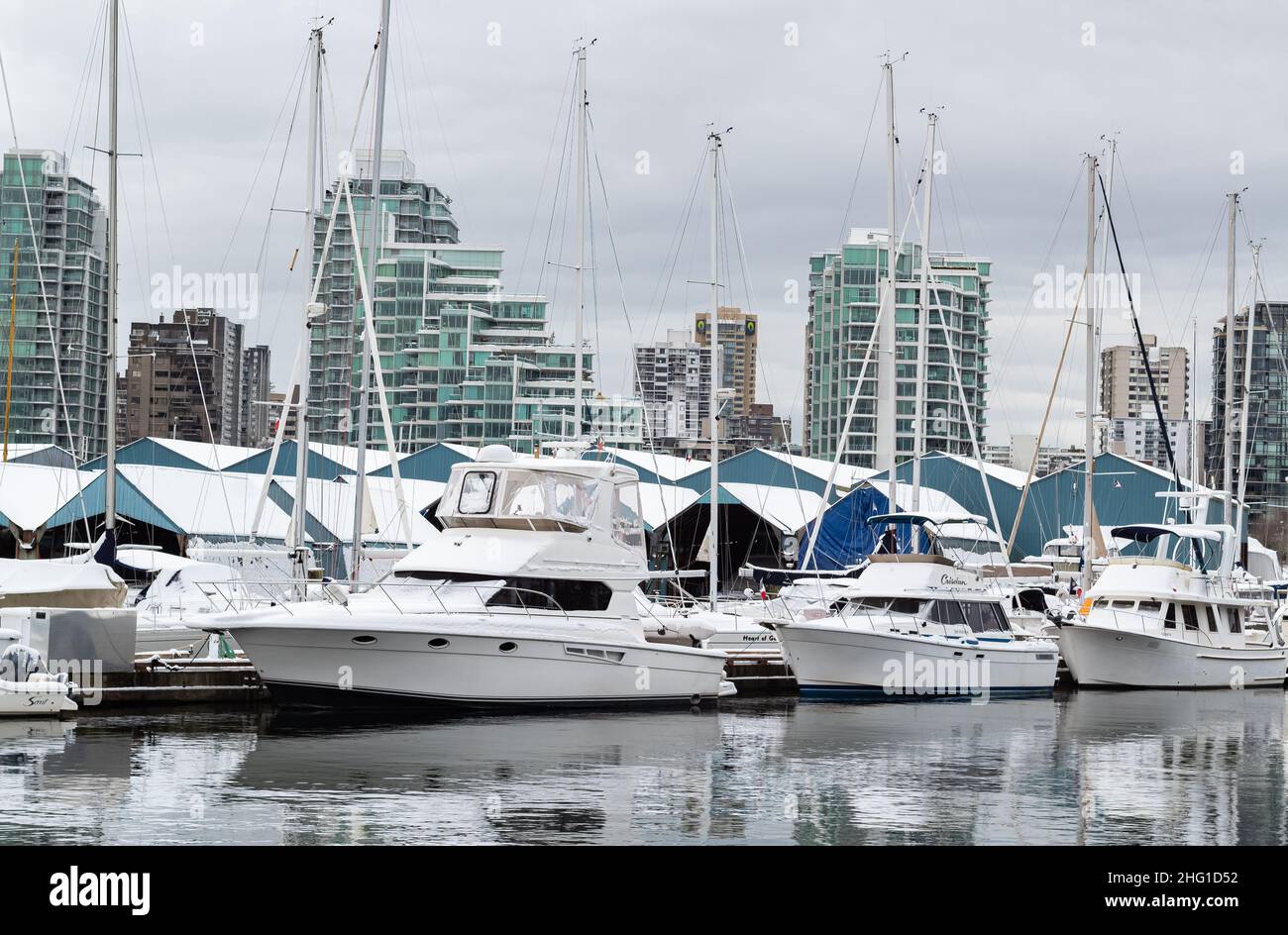 Vancouver British Columbia, Canada. Winter cityscape of Vancouver with yachts and boats in the harbour-December 26, 2021. Nobody, street view, Stock Photo