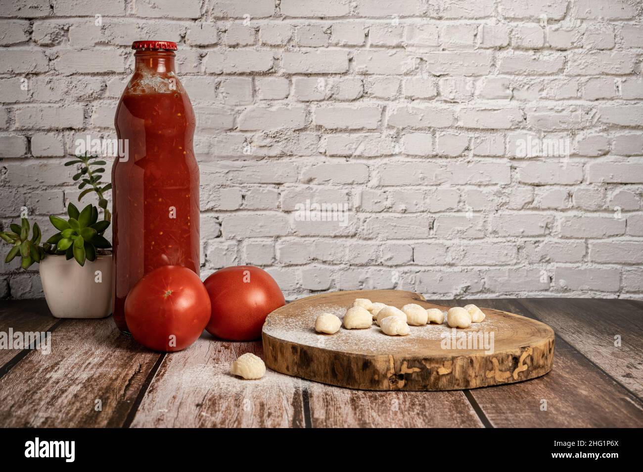 Preparation of homemade gnocchi with tomato sauce Stock Photo