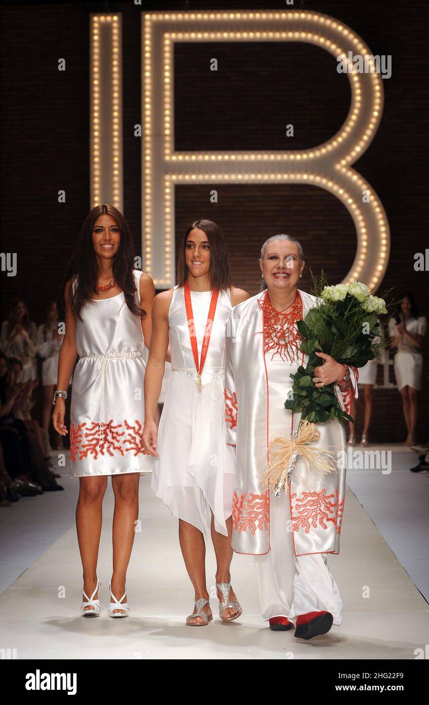 Italian judo lightweight Olympic gold medalist Giulia Quintavalle (center) with designer Laura Biagiotti (right) and her daughter Lavinia at the end of the Laura Biagiotti show during Milan Fashion Week. Stock Photo