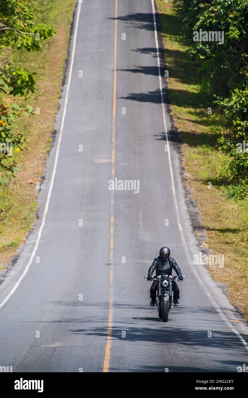 Man riding electric motorbike hi-res stock photography and images - Alamy