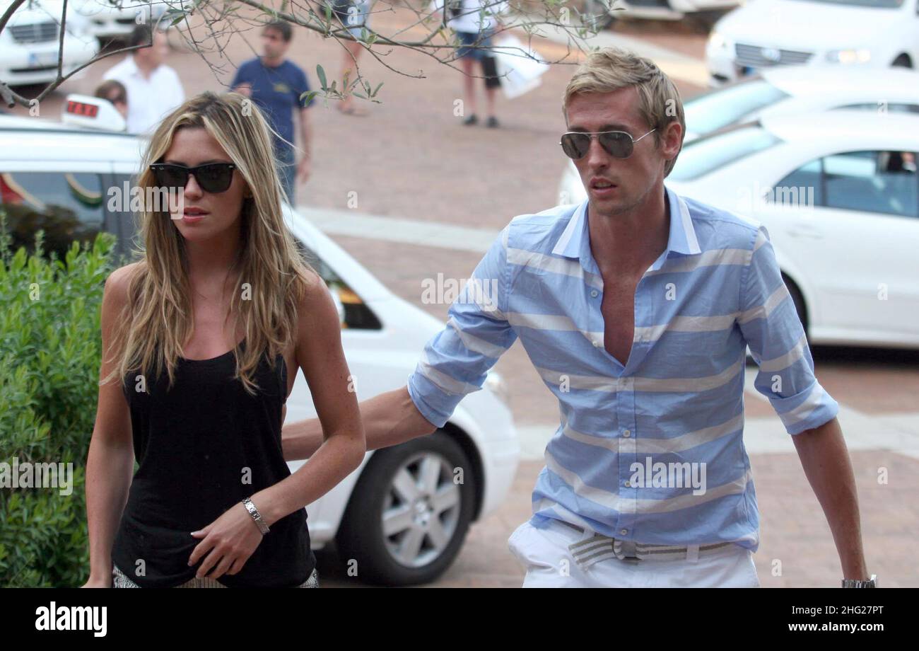 Peter Crouch and girlfriend Abigail Clancy out shopping whilst on holiday in PortoCervo, Sardinia. Stock Photo