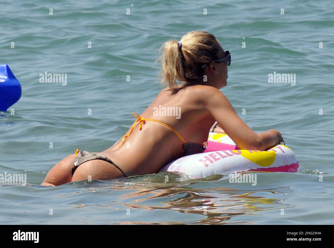 Ilary Blasi, wife of soccer player Francesco Totti, relaxing on the beach in the coastal town Sabaudia in Lazio, Italy. Stock Photo