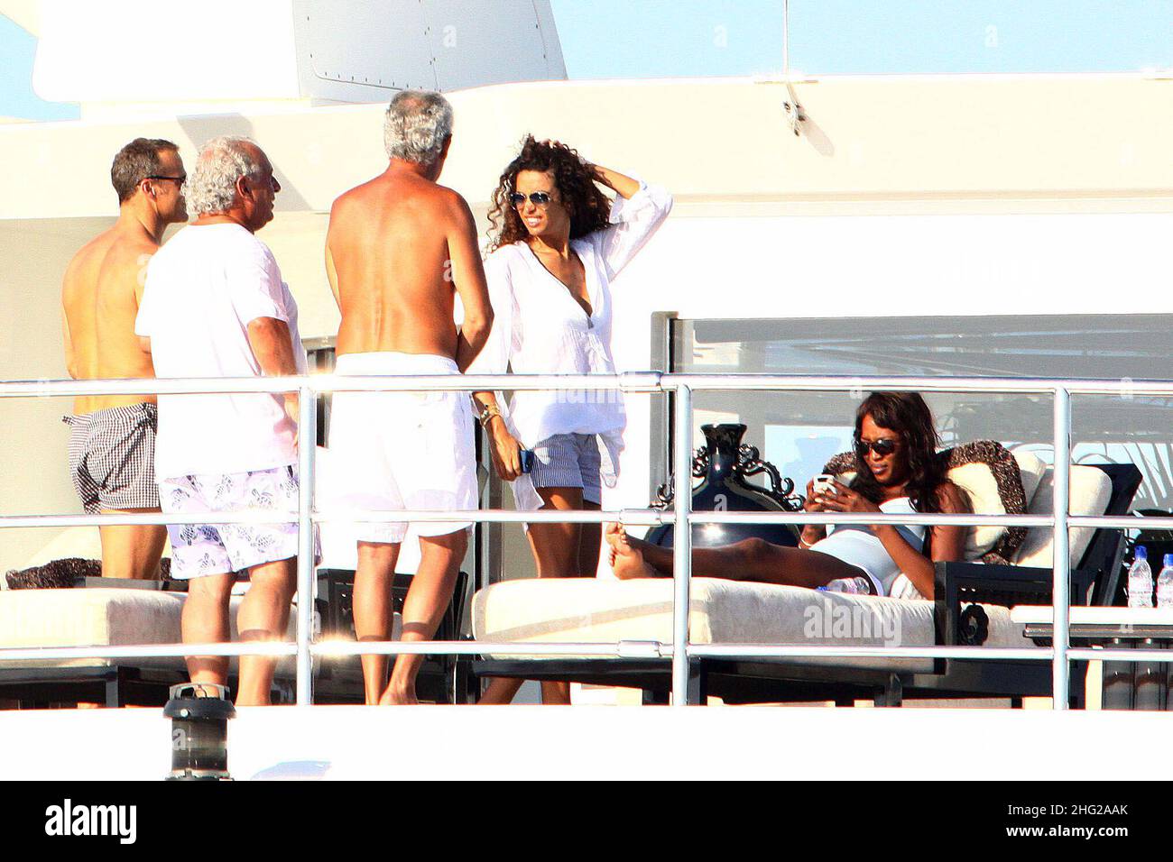 Naomi Campbell and boyfriend Vladimir Doronin and friends Marco Tronchetti Provera and Afef Jnifen on a yacht in Formentera, Spain   Stock Photo