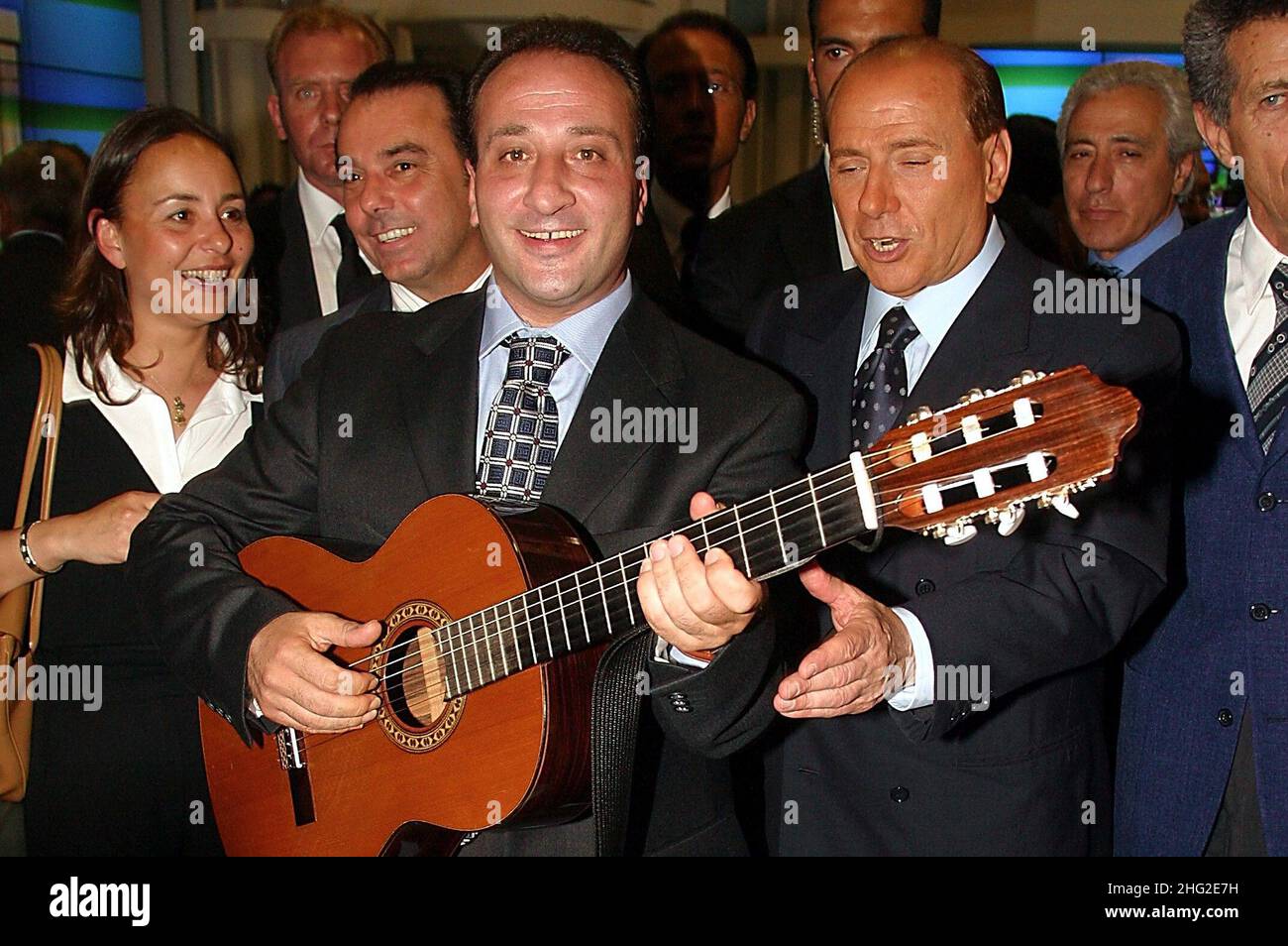 Silvio Berlusconi with Mariano Apicella before he performs a song