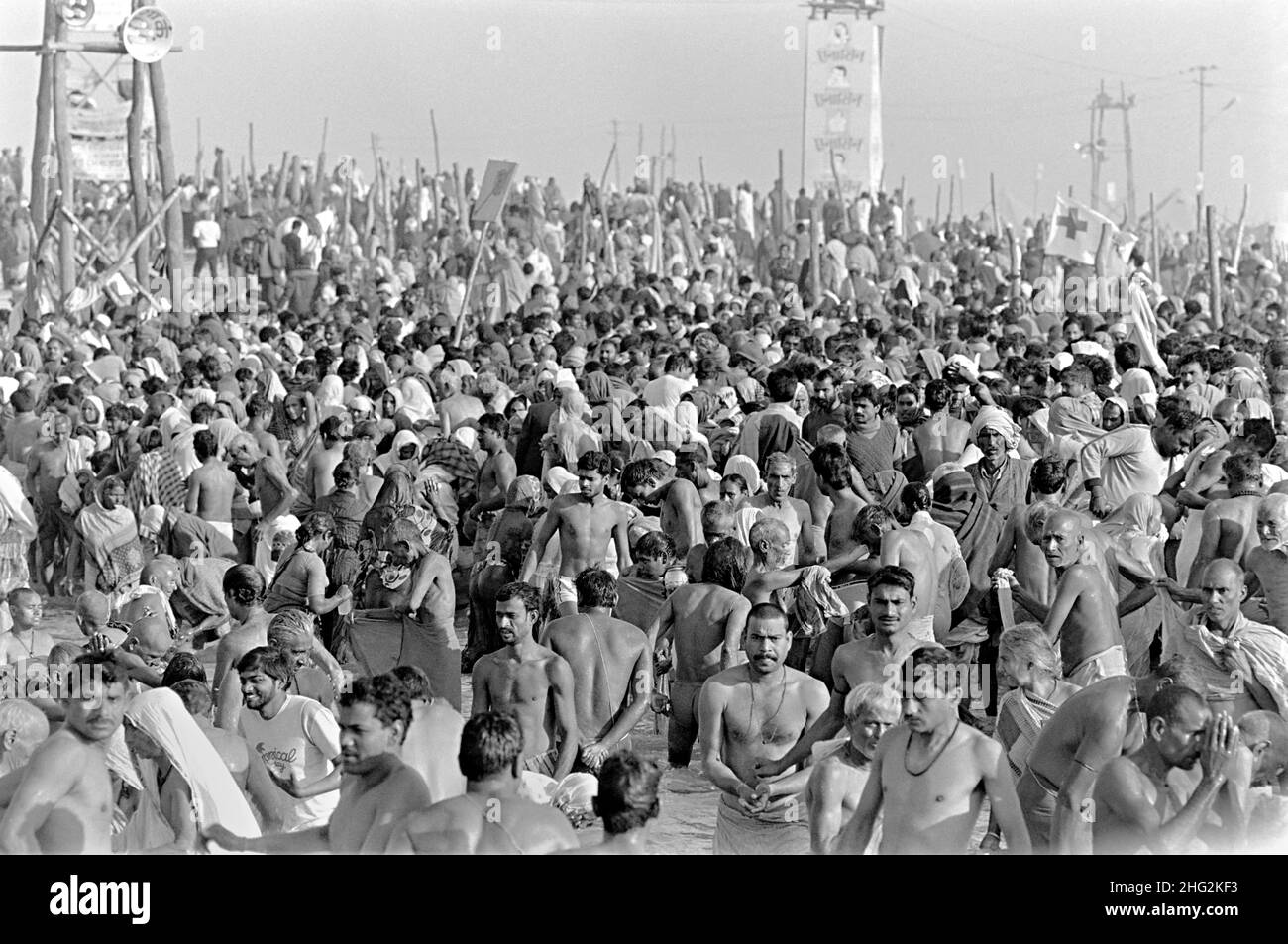 Indian pilgrims perform ritual bathing in the confluence of the Ganges and Yamuna Rivers at the climax of the Kumbh Mela festival February 6, 1989 in Allahabad, India. The six-week festival is held every 12th year and attracts millions of Hindu pilgrims. Stock Photo