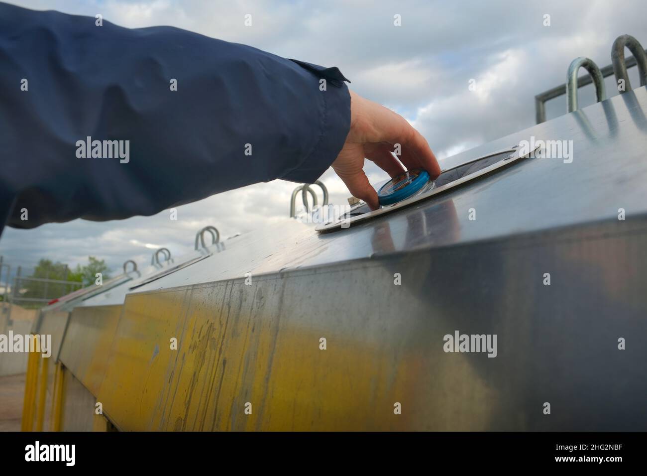 Sorted garbage.Separate waste sorting. A man's hand puts an empty glass