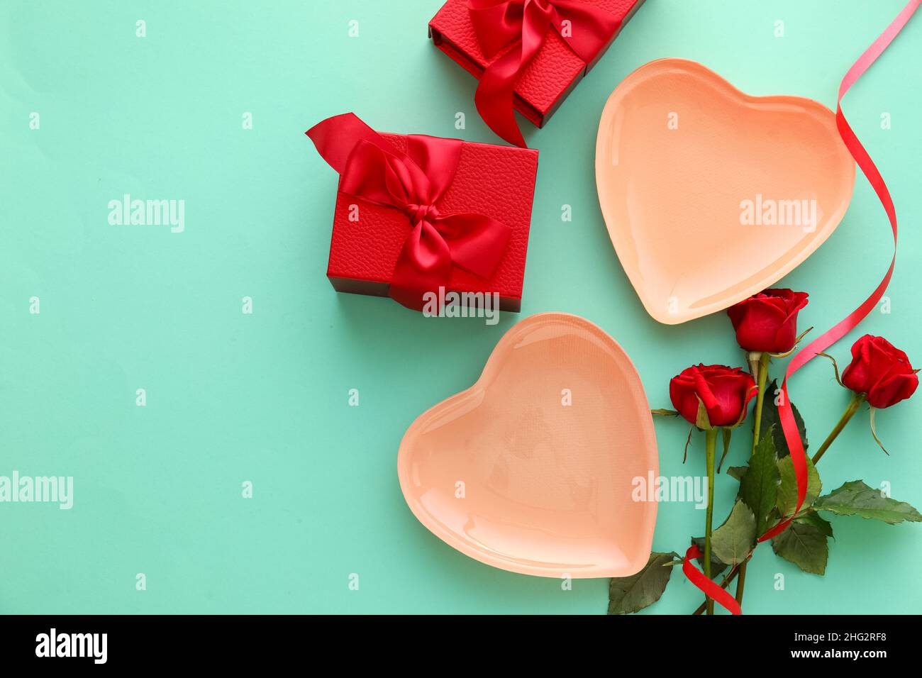 Beautiful table setting for Valentine's Day, gift boxes and rose ...
