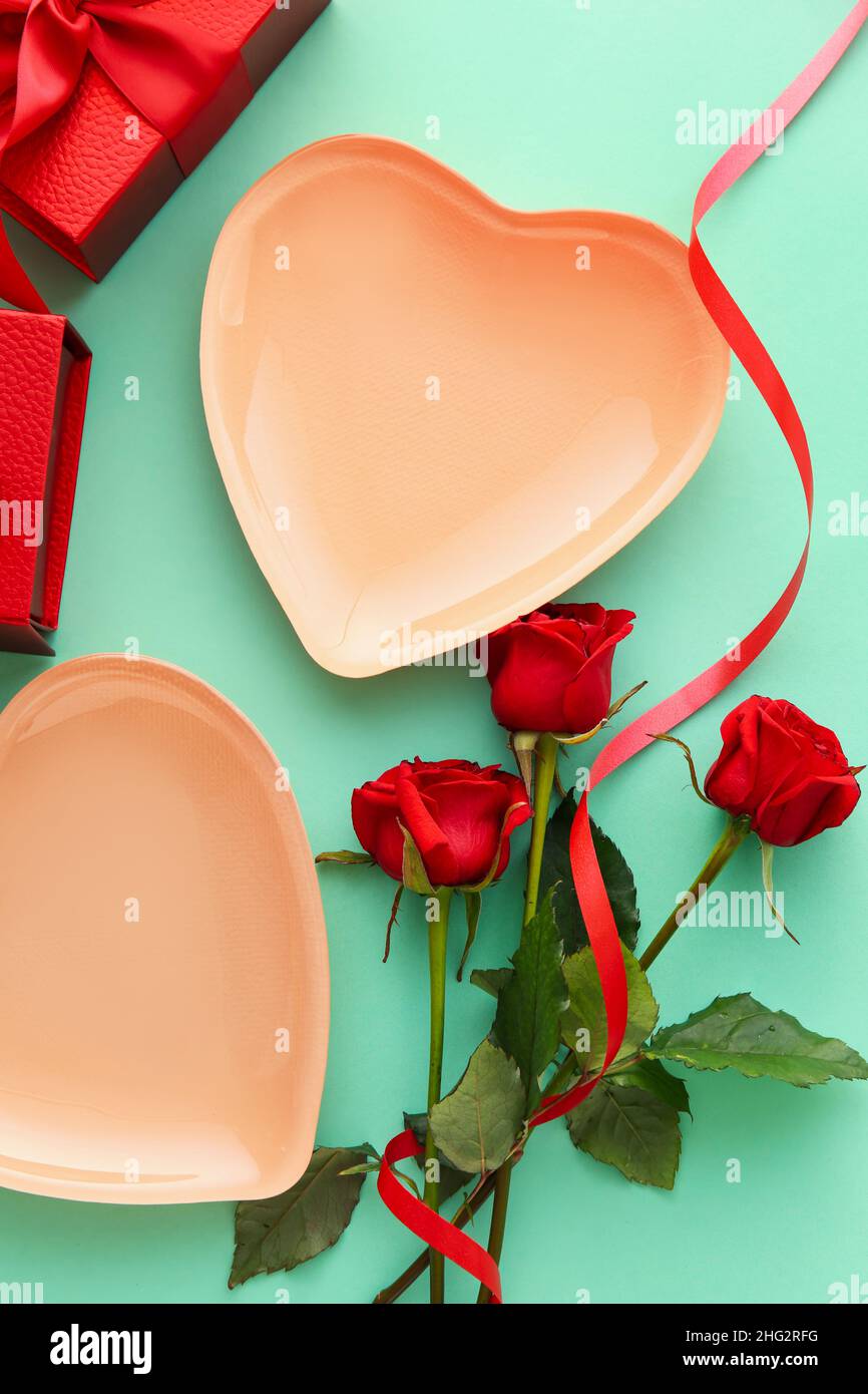 Beautiful table setting for Valentine's Day, gift boxes and rose ...
