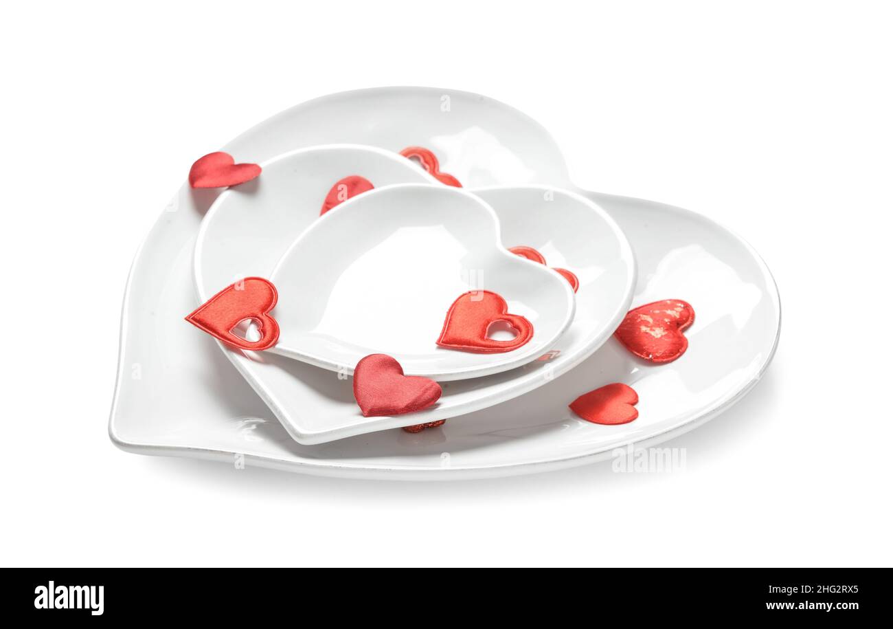 Beautiful heart shaped plates on white background Stock Photo - Alamy