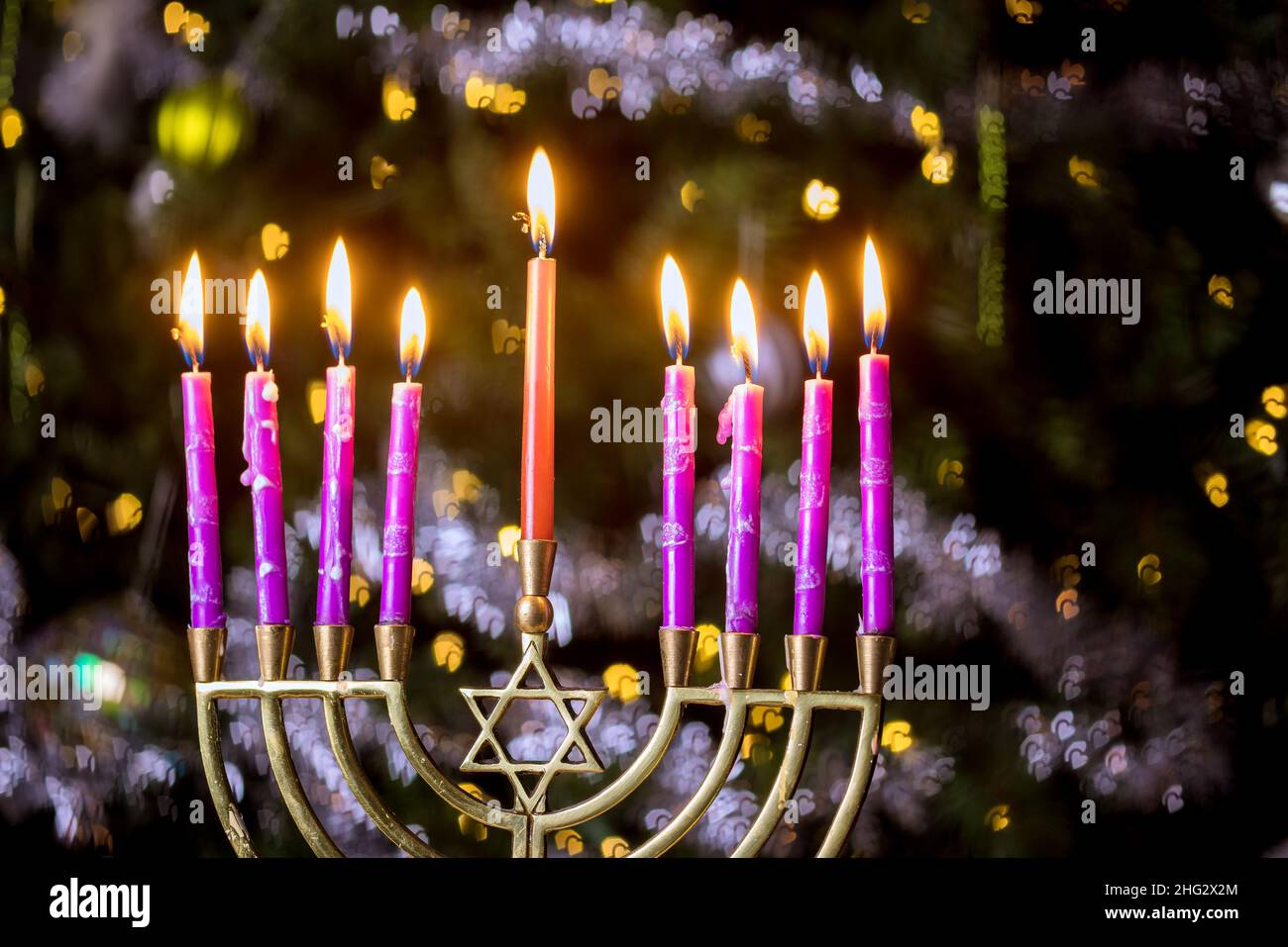 Jewish Religion holiday symbol for Hanukkah in hanukkiah Menorah with burned out candles Stock Photo