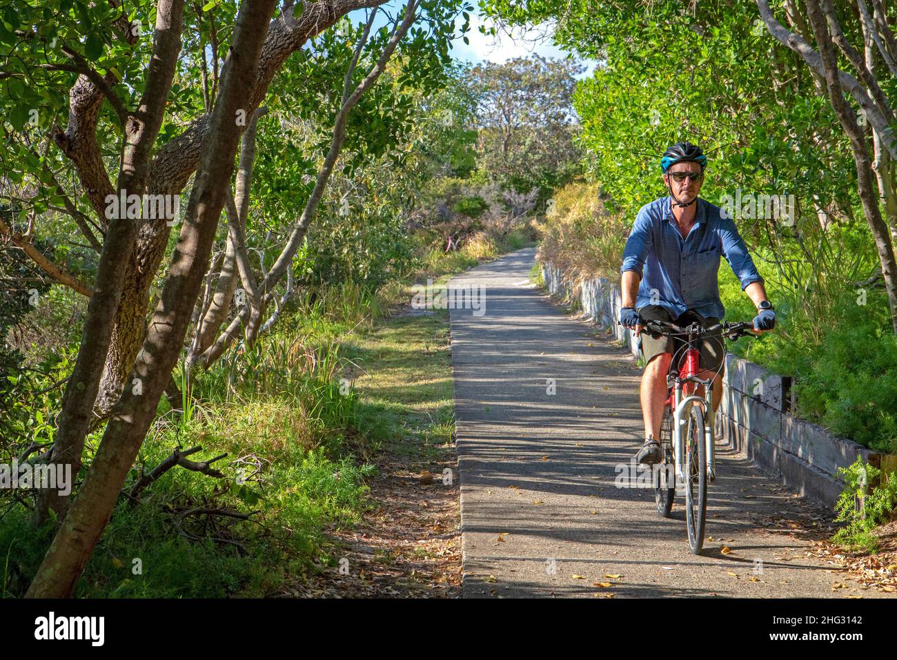 Cycling on the Coastal Pathway, which runs the length of the Sunshine Coast Stock Photo Alamy