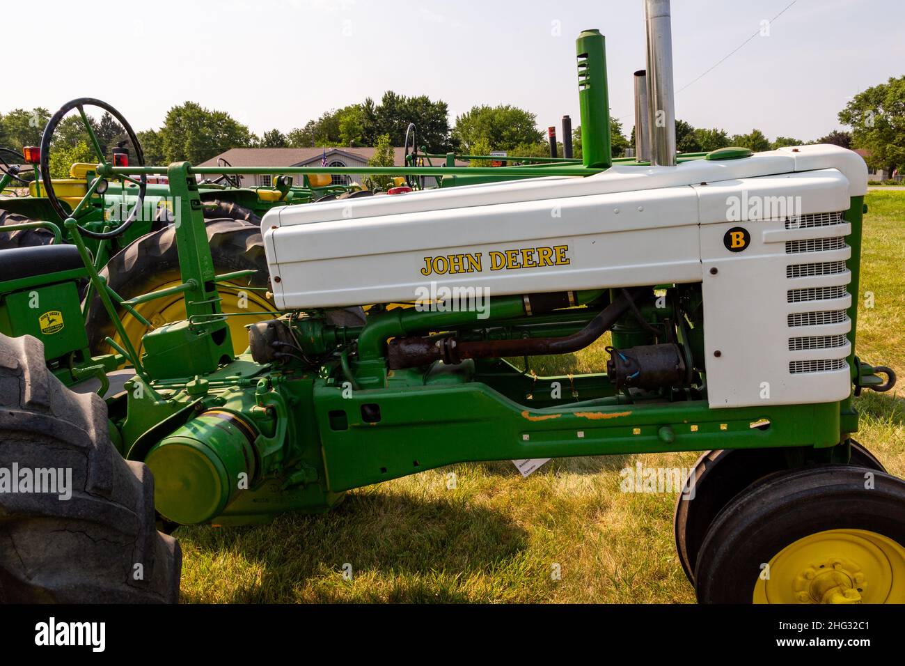 An antique John Deere Model B row crop farm tractor on display at a tractor show in Warren, Indiana, USA. Stock Photo