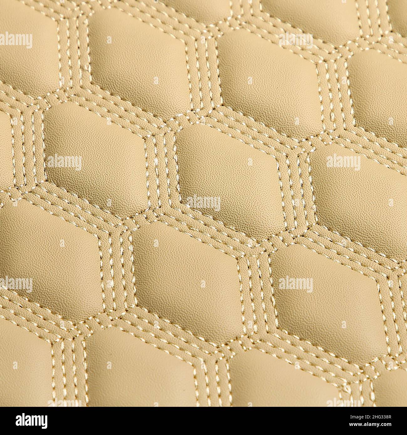 Texture of beige leather background with square pattern and stitch, macro Stock Photo