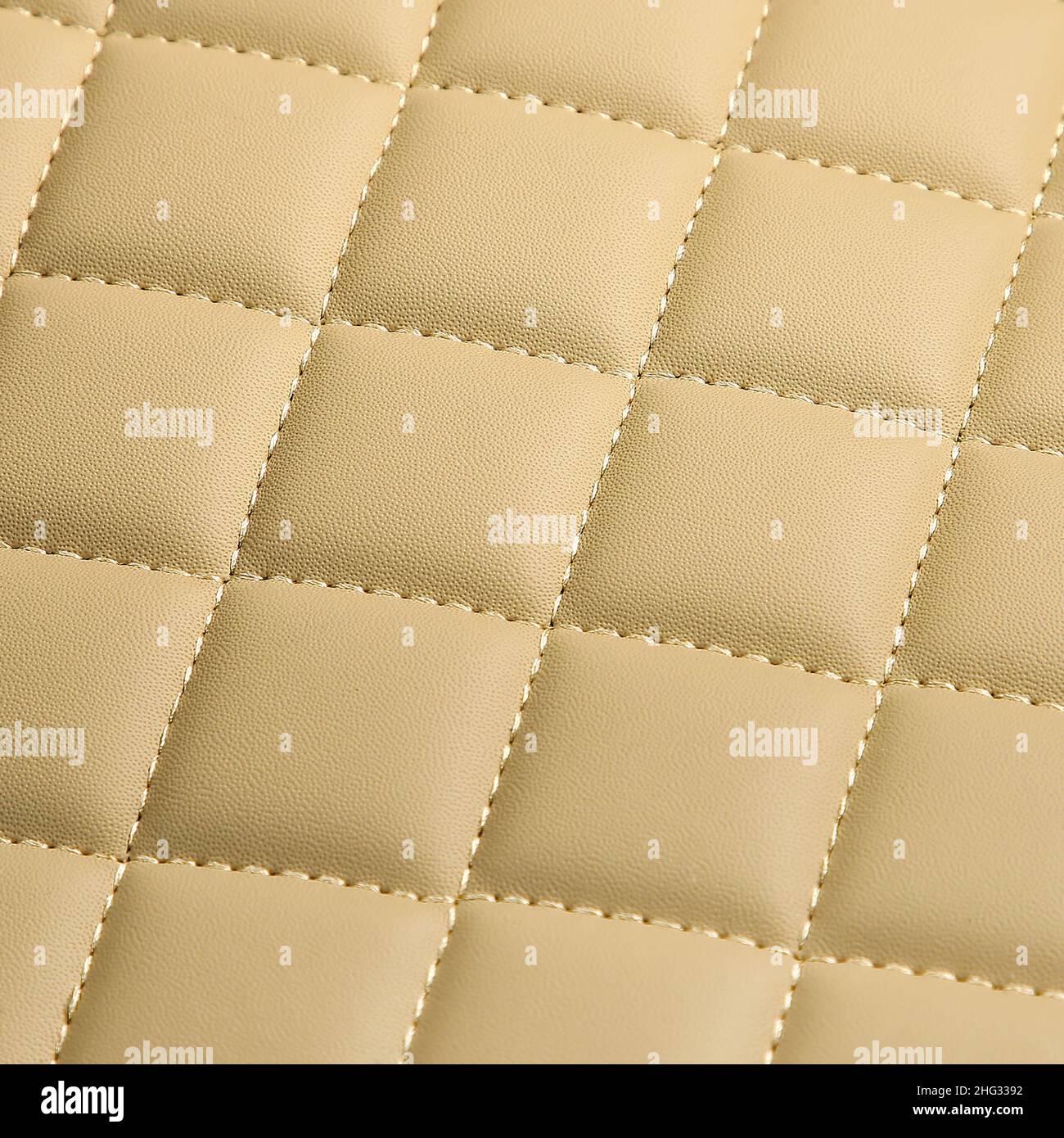 Texture of beige leather background with square pattern and stitch, macro Stock Photo