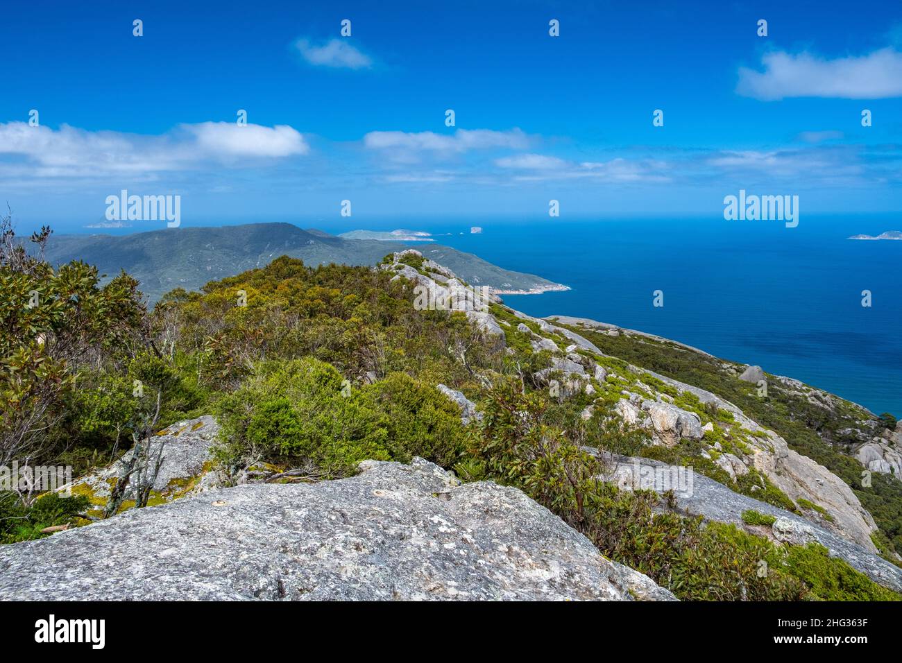 Green hills and vivid blue ocean in Victoria, Australia Stock Photo