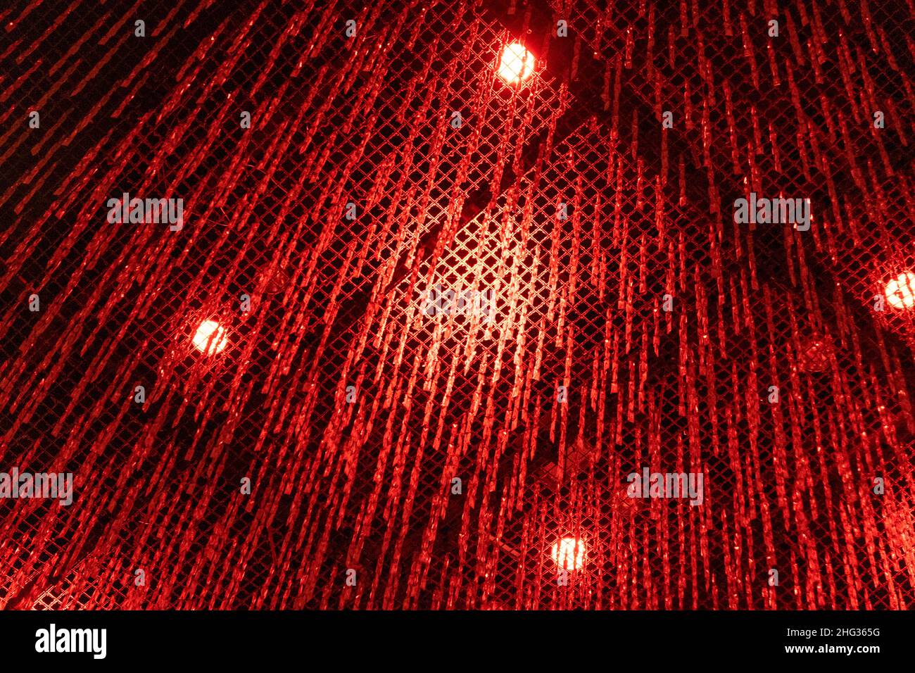 Looking up at ceiling decrated with red Christmas decorations Stock Photo