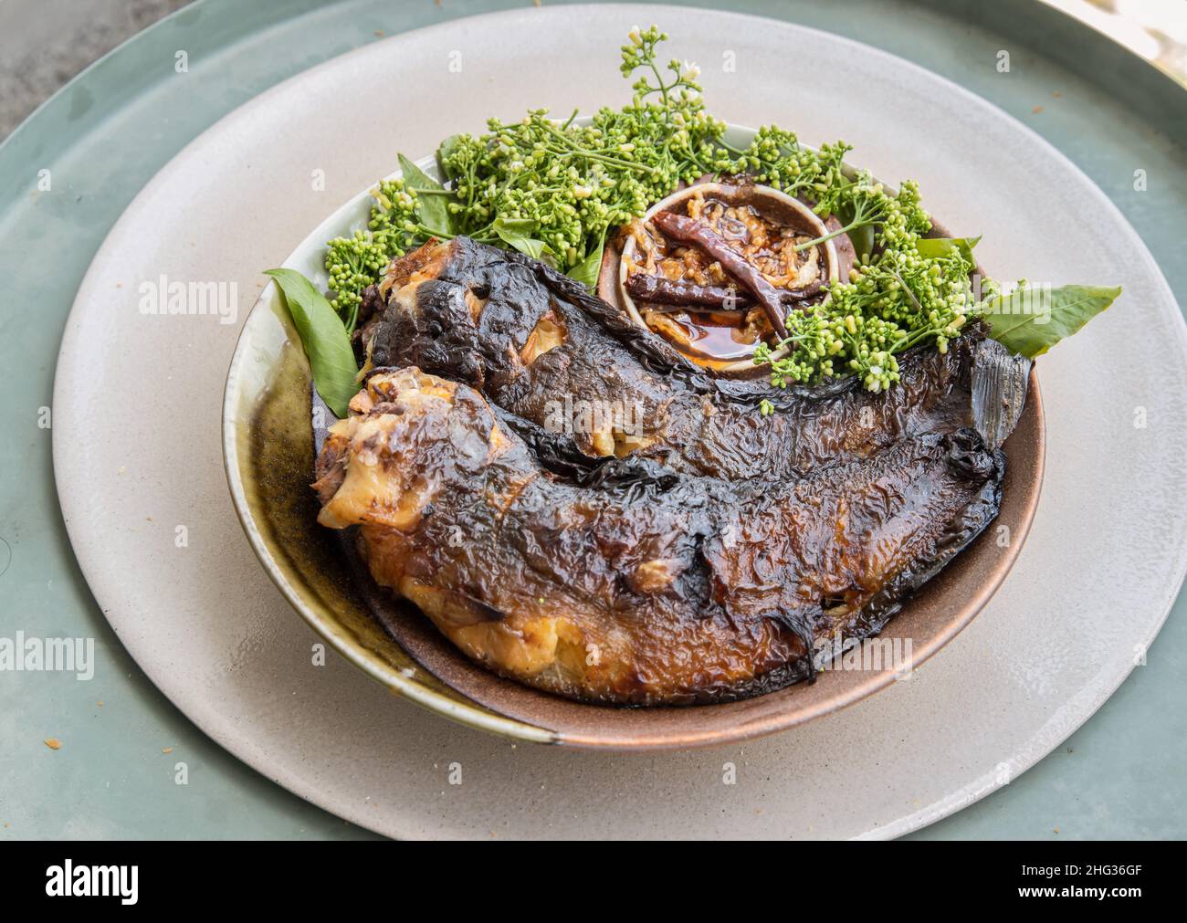 Grilled catfish (Roasted Catfish) and neem leaf served with sweet