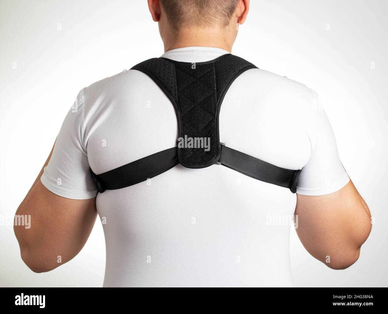 A Male is Wearing an Orthopedic Posture Corrector. Treatment for