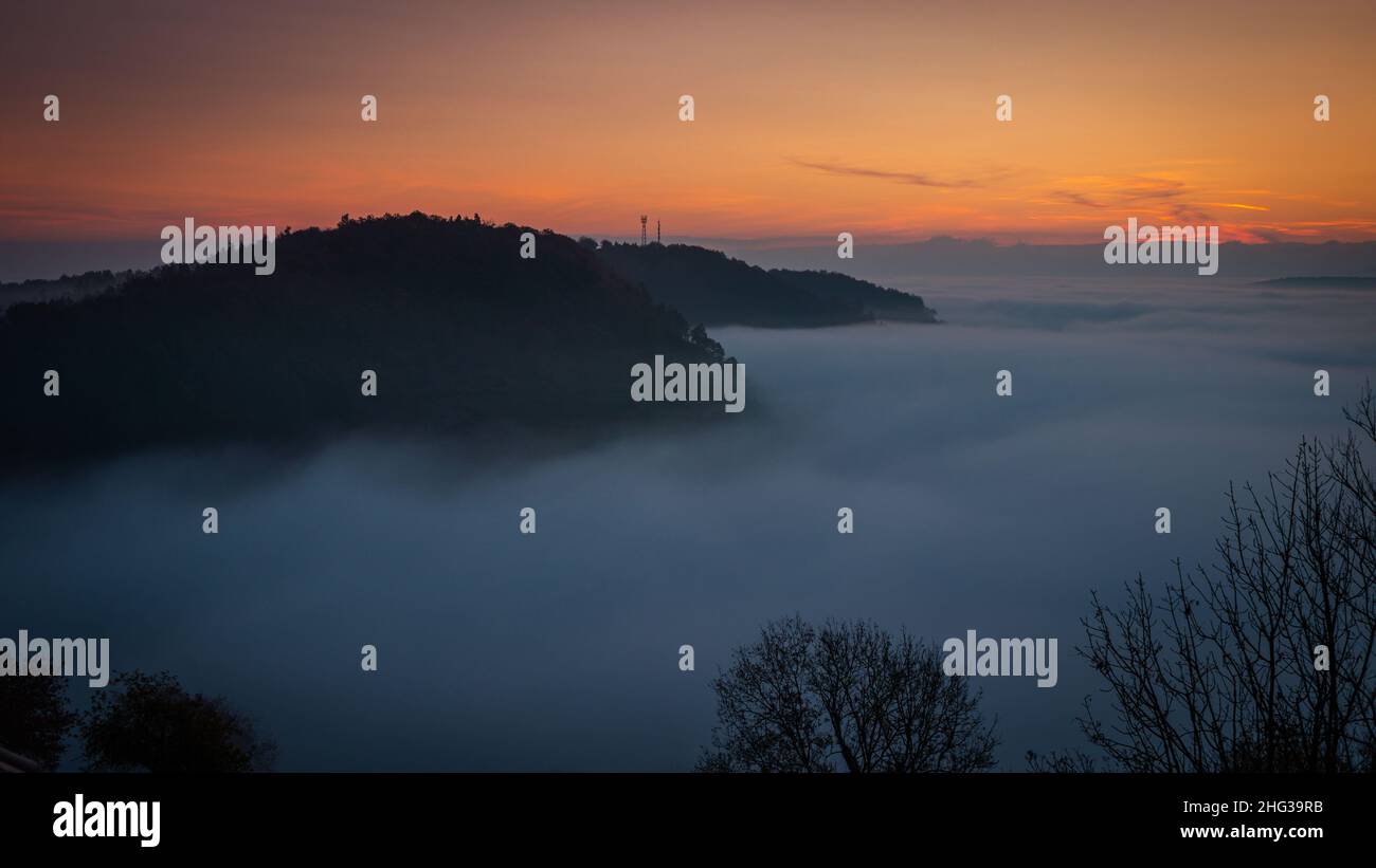 Landscape in the morning fog at dawn. sunrise. sun rays at dawn. Stock Photo