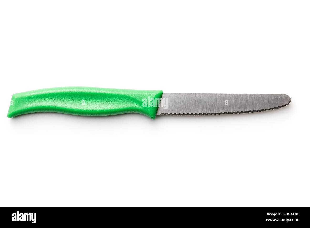 Green plastic kitchen knife isolated on white background. Stock Photo