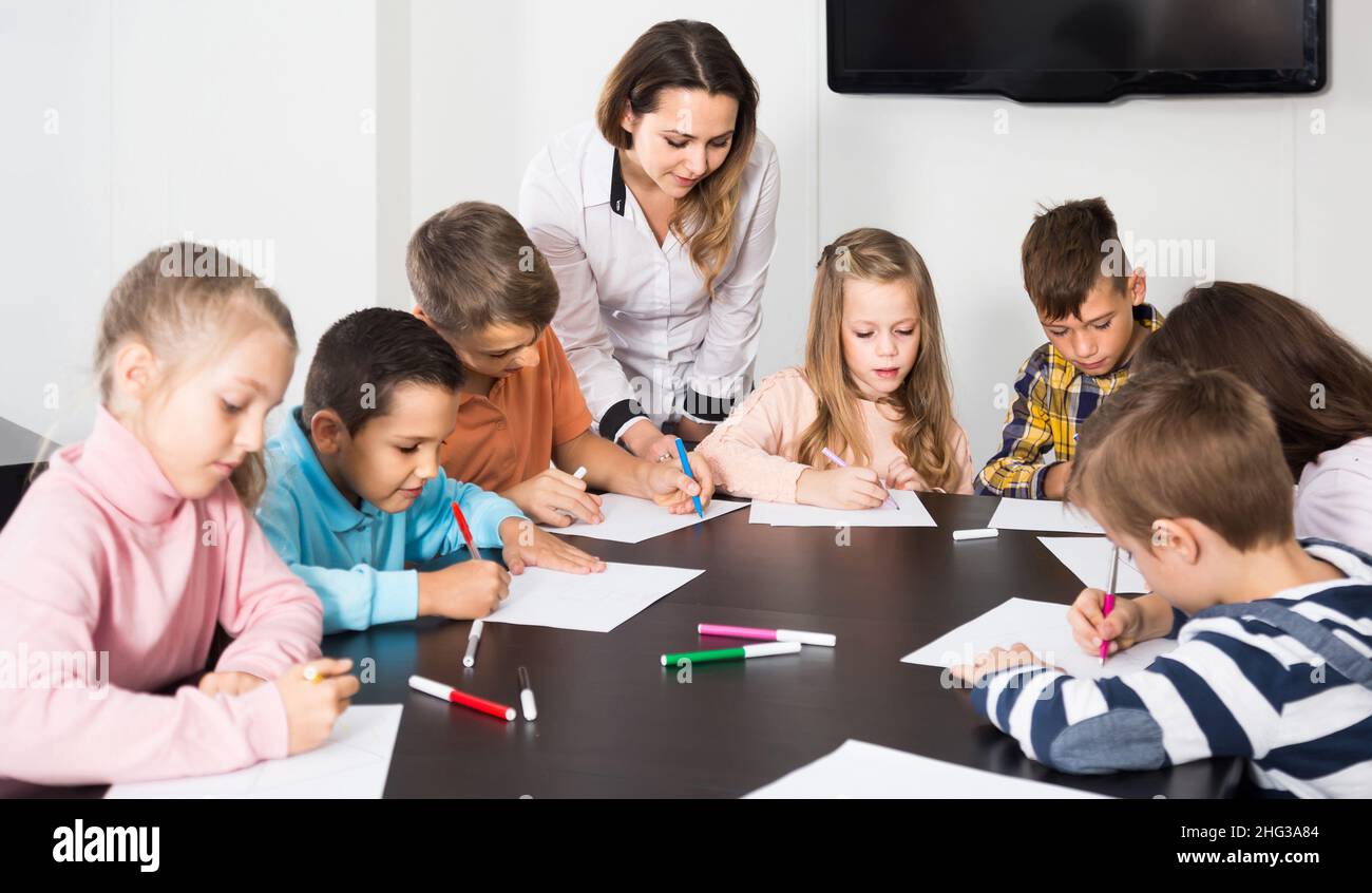 Children of elementary age having class of art Stock Photo - Alamy