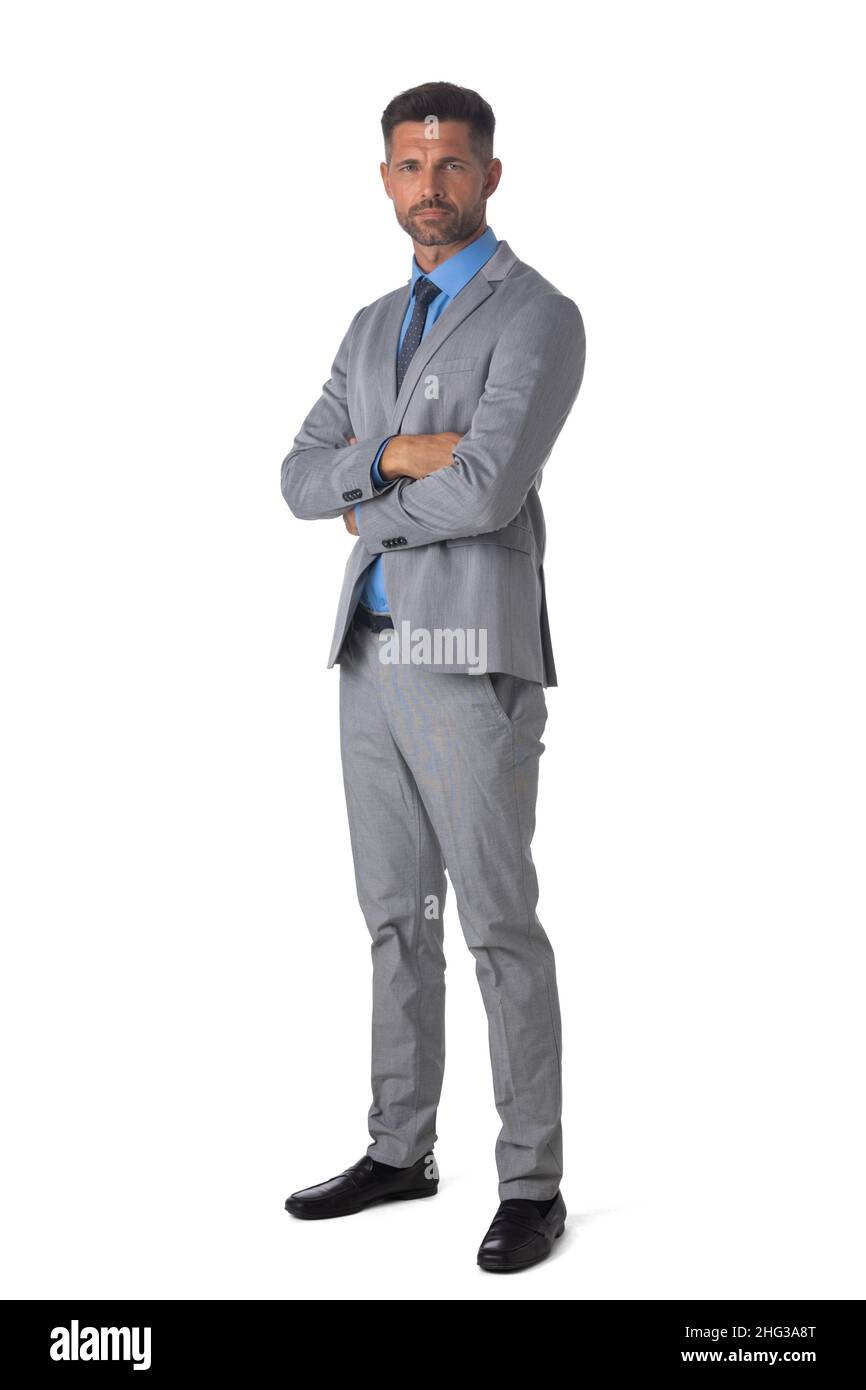 Portrait of handsome businessman standing with arms crossed isolated on ...