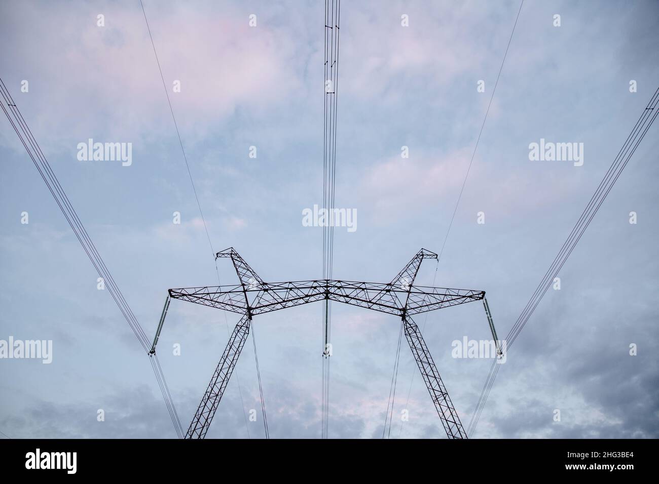 Power transmission lines against a blue sky Stock Photo - Alamy