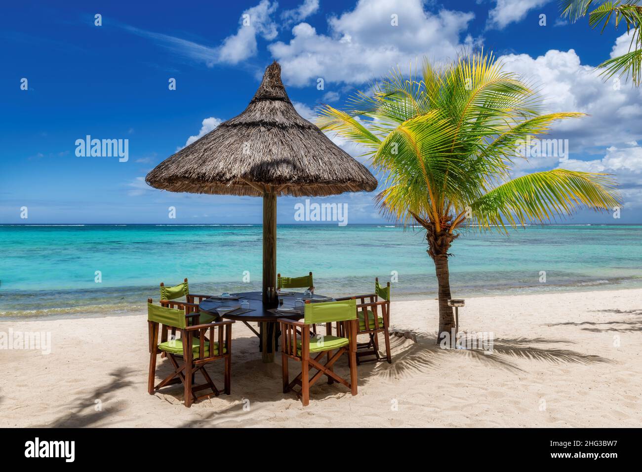 Beach restaurant on sandy tropical beach Stock Photo