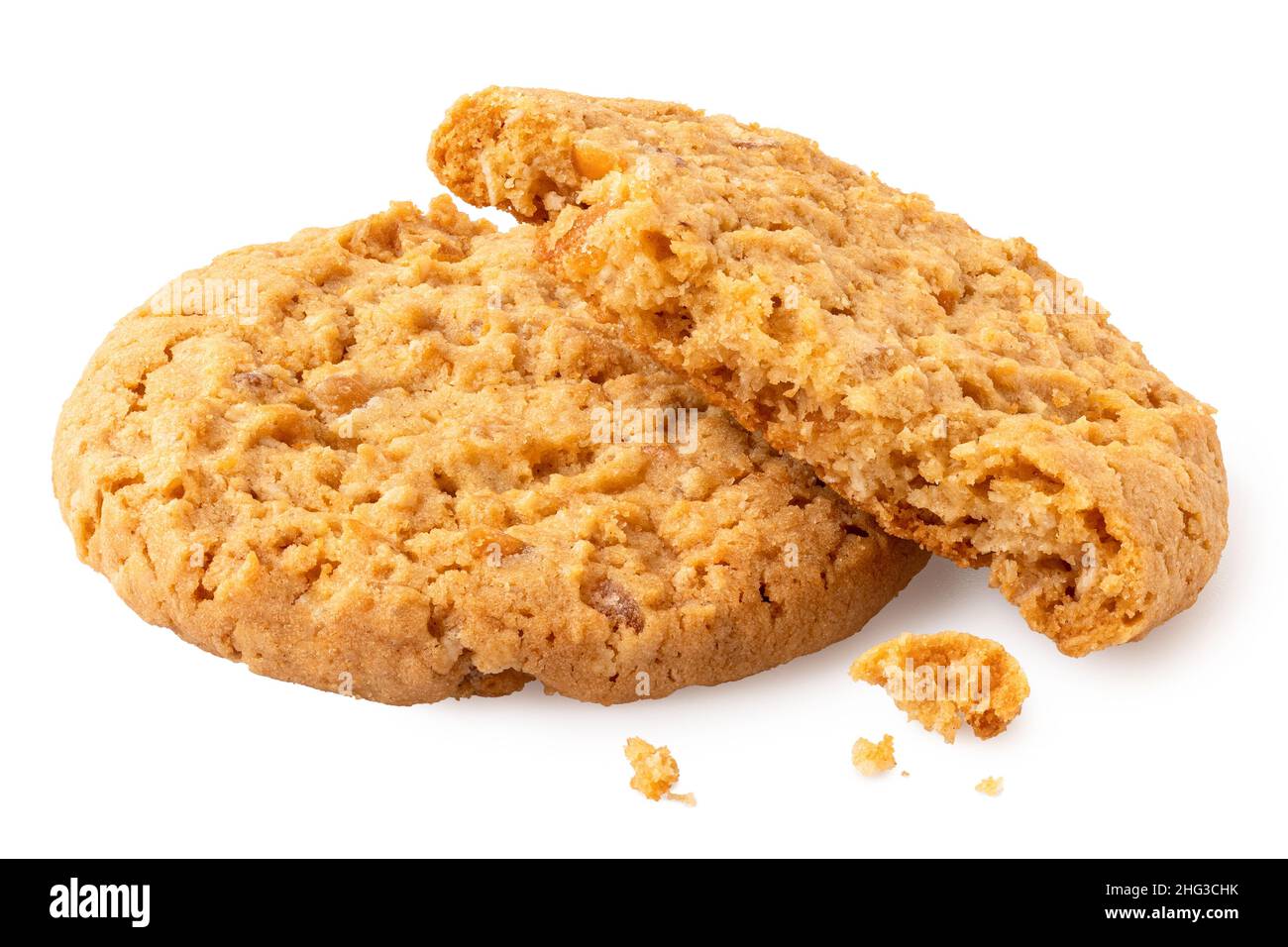 One and half stem ginger biscuits with crumbs isolated on white. Stock Photo