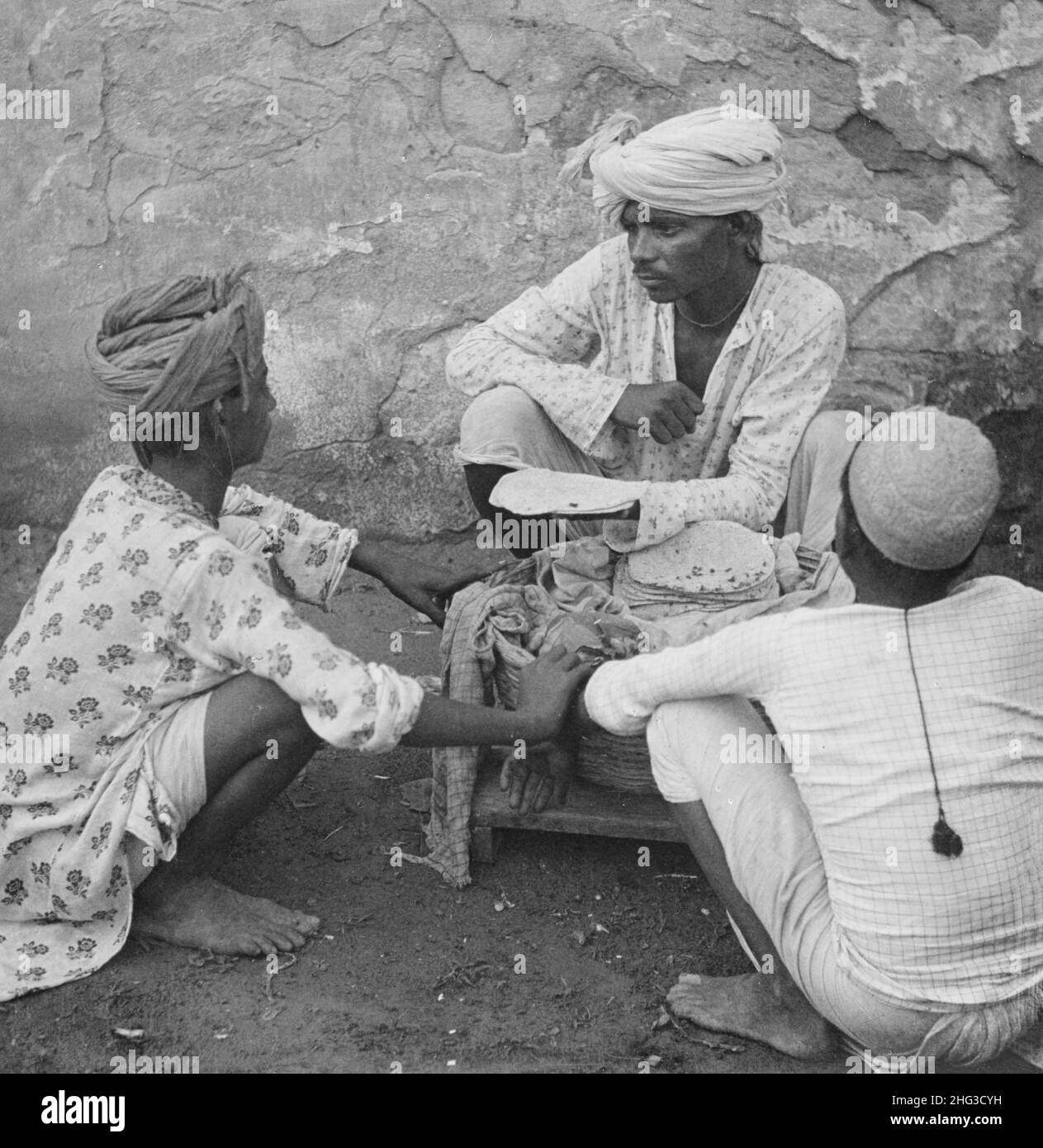 Vintage photo of Indian men. A bread 'wallah,' Jeypore, India. 1905 Stock Photo