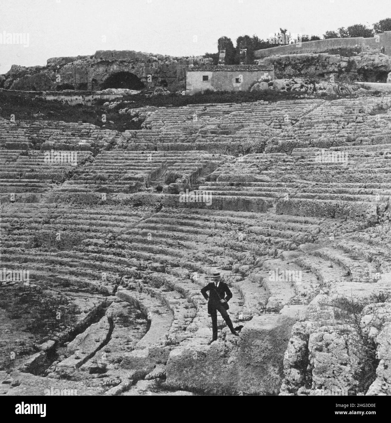 Vintage photo of the wonderful Greek theatre, hewn from solid rock (5th century B.C.) at ancient Syracuse, Sicily. 1907 Stock Photo