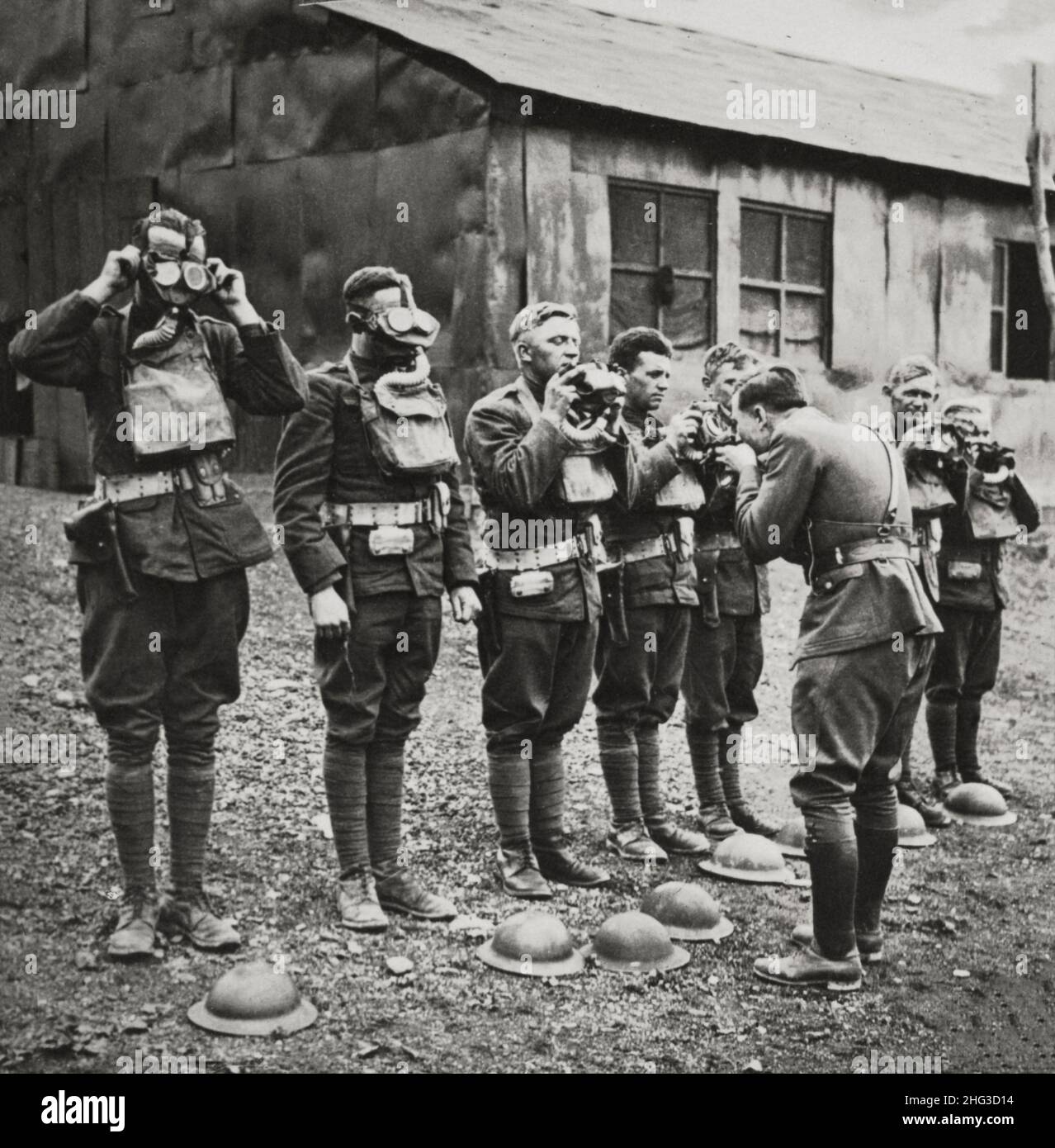 Vintage photo of American boys in France learning to correctly use gas masks. France Stock Photo