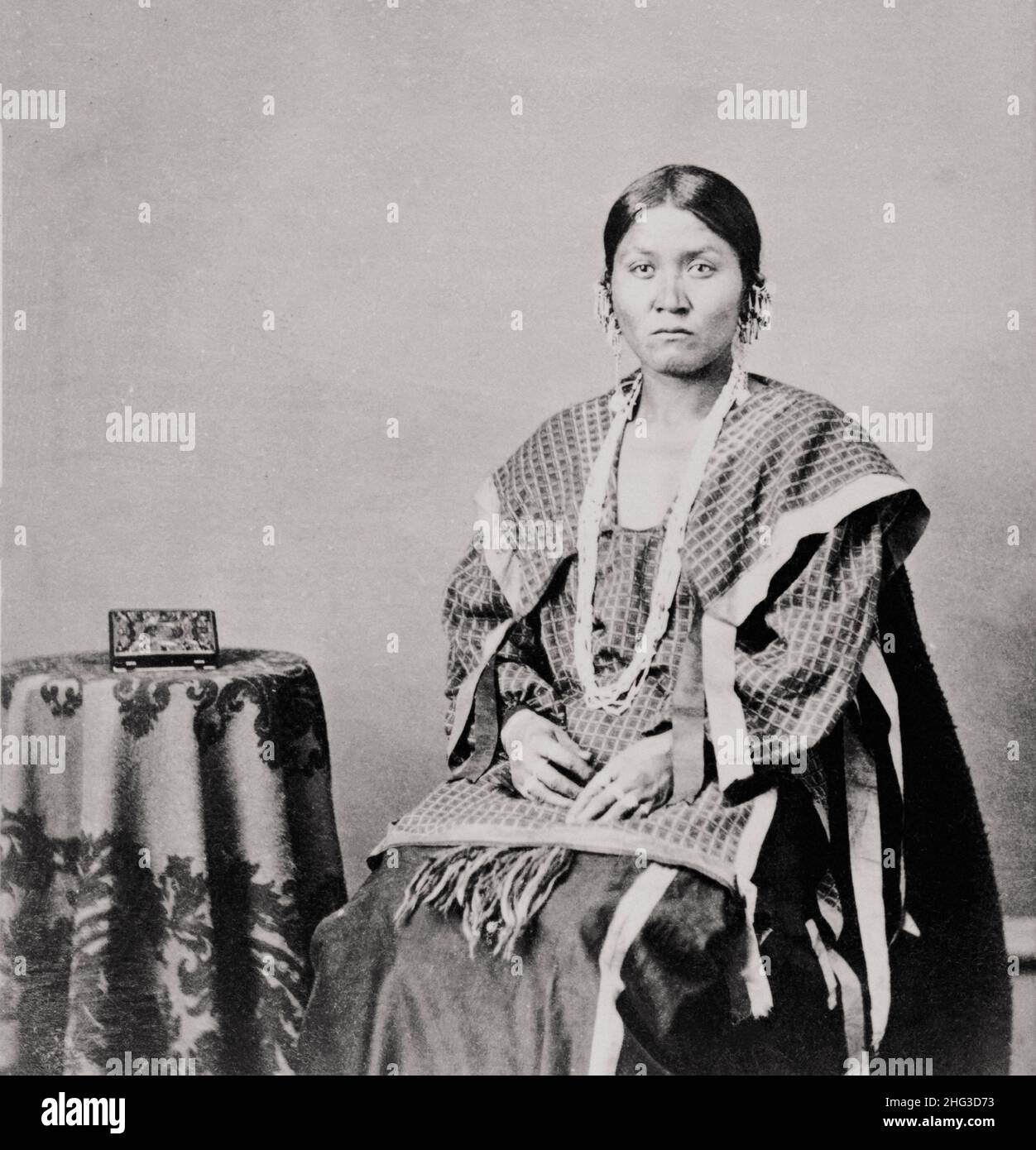 Vintage photo of Winnebago woman, full-length portrait. USA. 1865-1880 Stock Photo